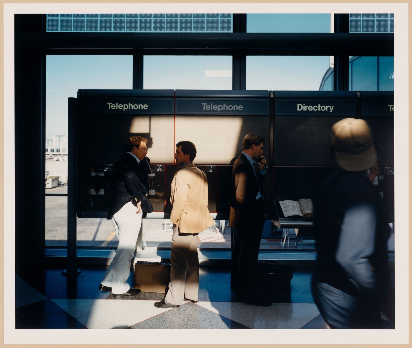 ORD: O’Hare Airfield: View of Passengers using telephones in Terminal 1, Chicago, Illinois