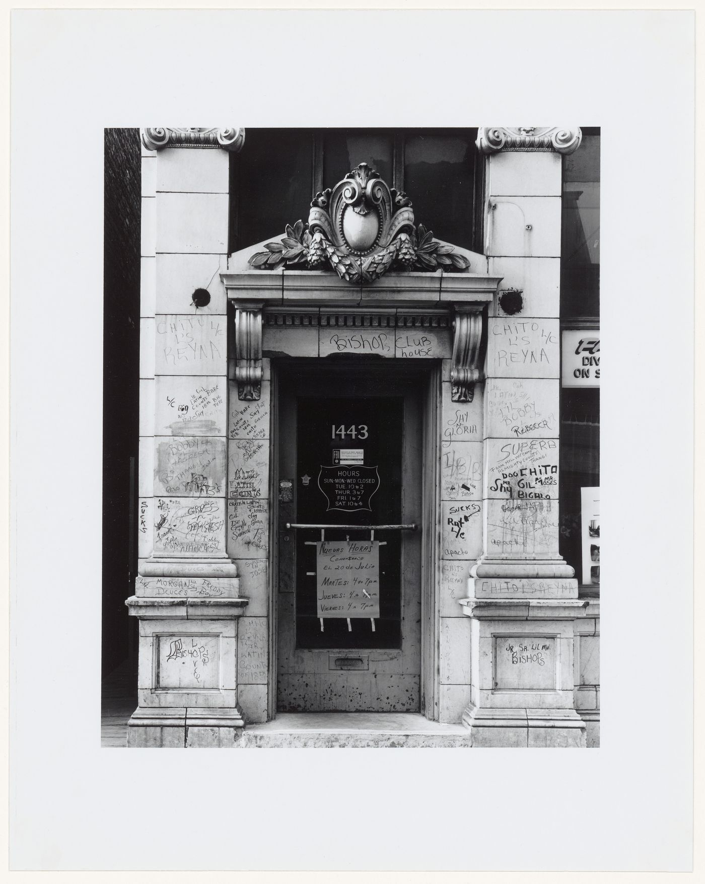 Close-up view of an ornate doorway with sculpture and graffiti, 1443 18th Street, Chicago, Illinois, United States