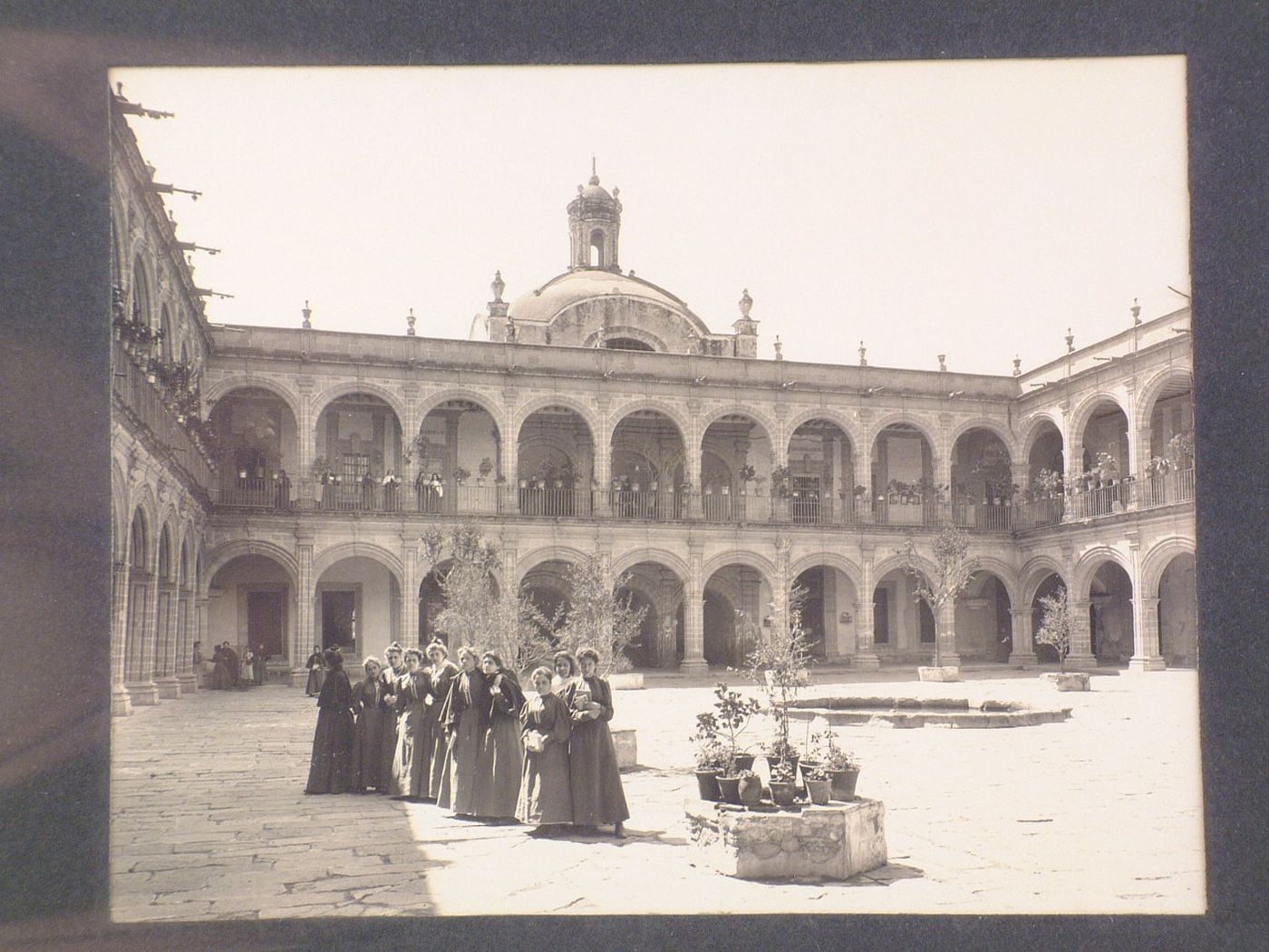 View of the principal patio of the Colegio de las Vizcaínas showing a group of women in the foreground and the dome over the principal stairs in the background, Mexico City, Mexico