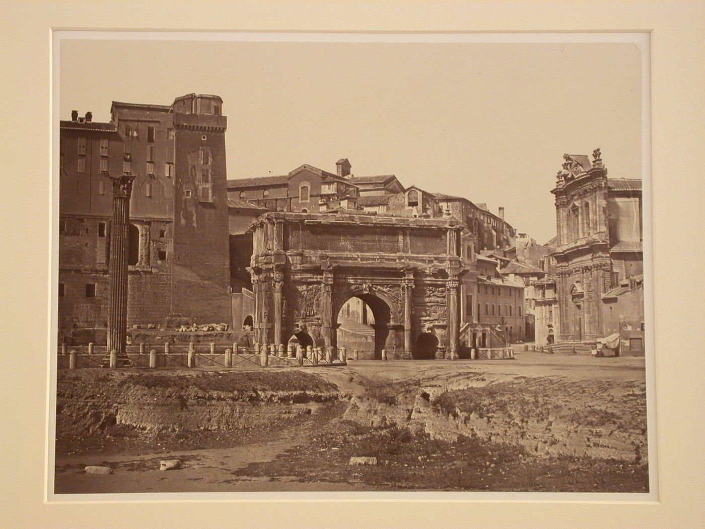 Roman forum, Arch of Septimius Severus and corner of Palazza Sarratono, with church at right, Rome, Italy