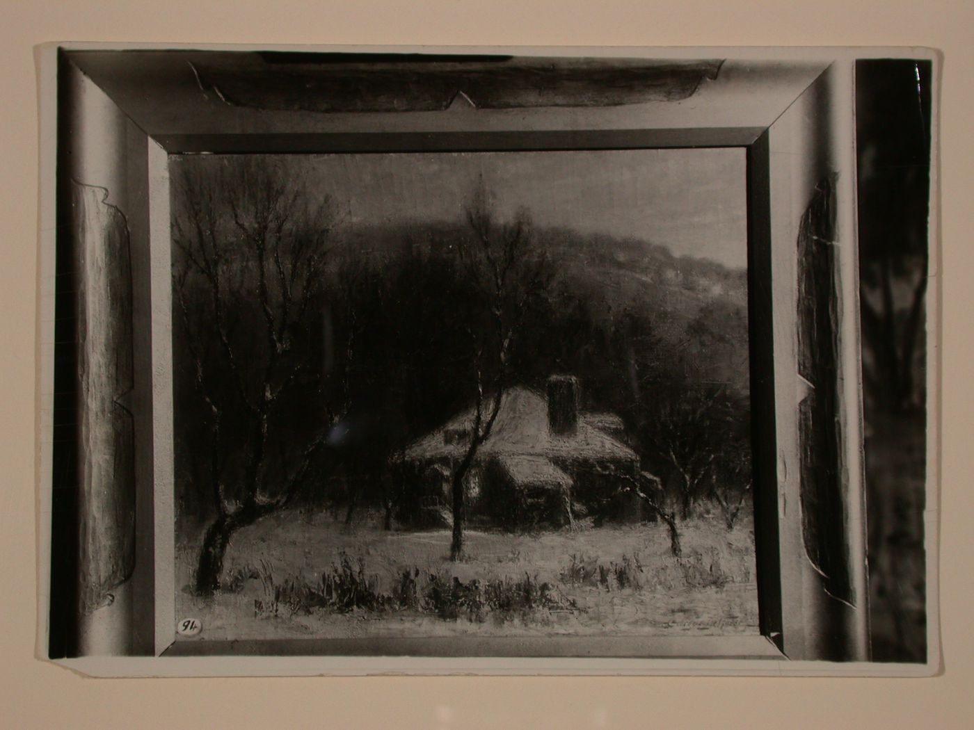 Photograph of a painting of a house in winter