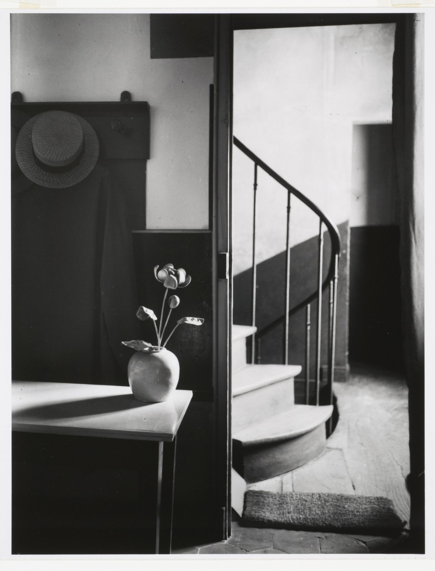 Interior view of Mondrian's studio with flower in vase, and stairway, Paris, France