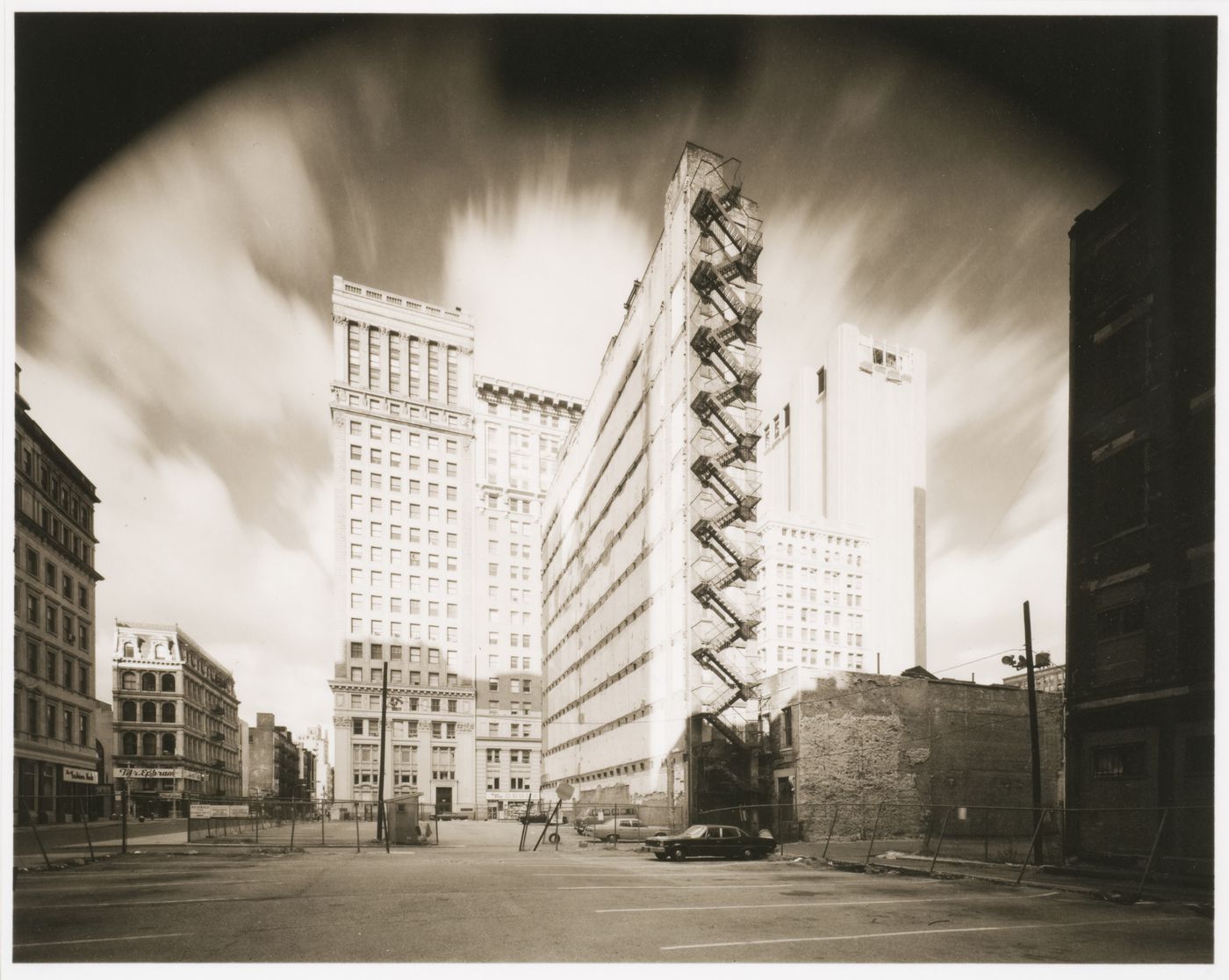 Parking lot with tall buildings in back, New York City, New York