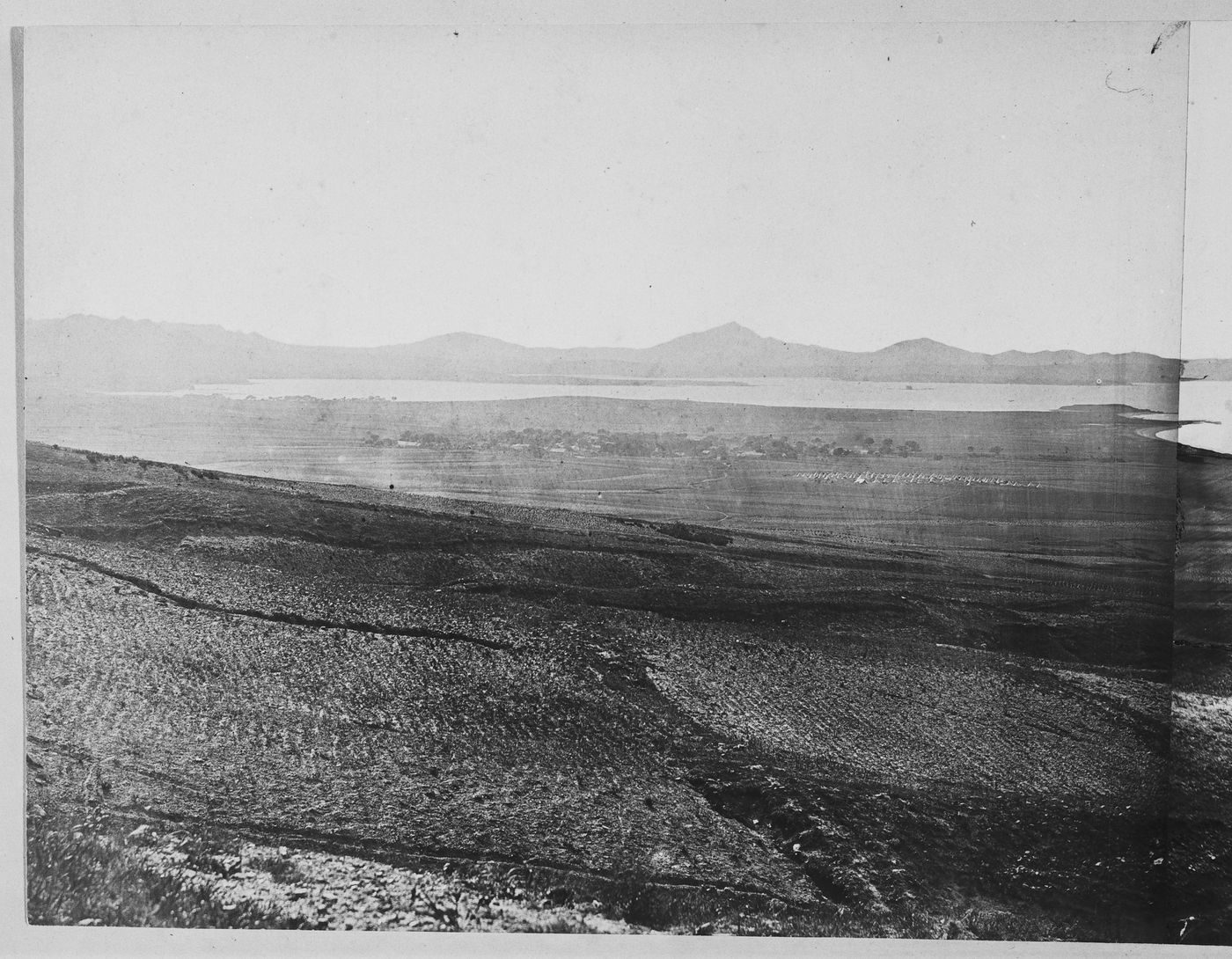 View of Victoria Bay, adjacent to Talien Bay (now Dalian Wan), showing military camps and farmland, near Ch'ing-ni-wa (now part of Dalian), China