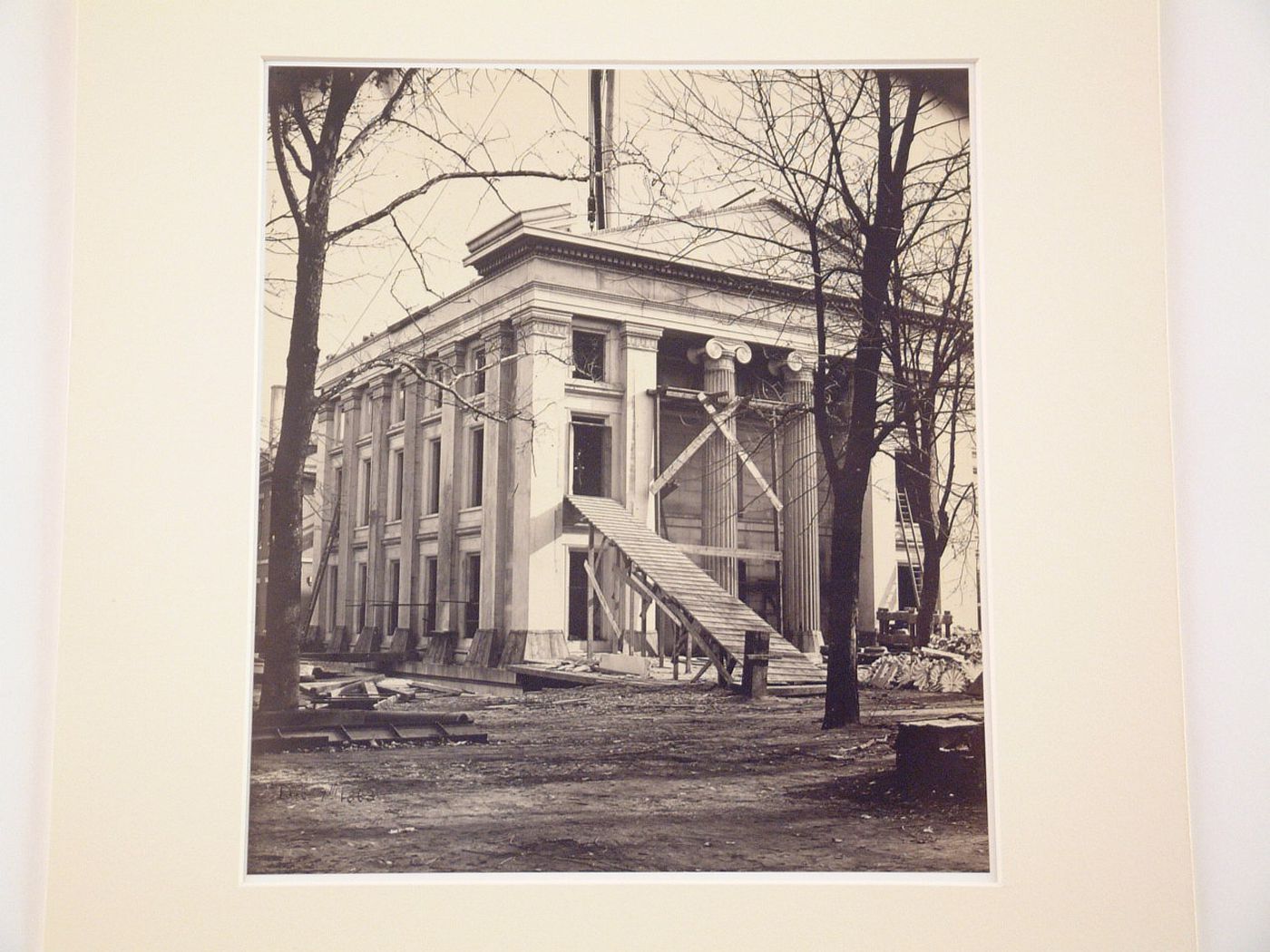 Treasury Building under contruction: Corner of building, ramp leading to figure standing in second-floor window, Washington, District of Columbia