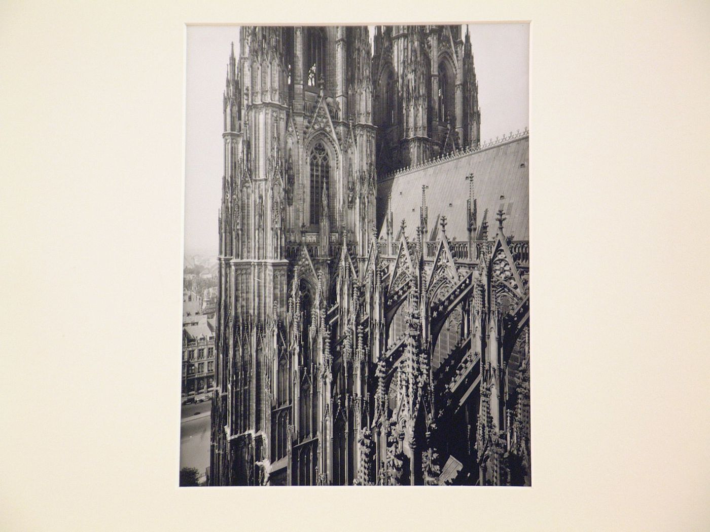 Detail, exterior of the Kölner Dom showing part of towers, nave roof, and butresses, Cologne, Germany