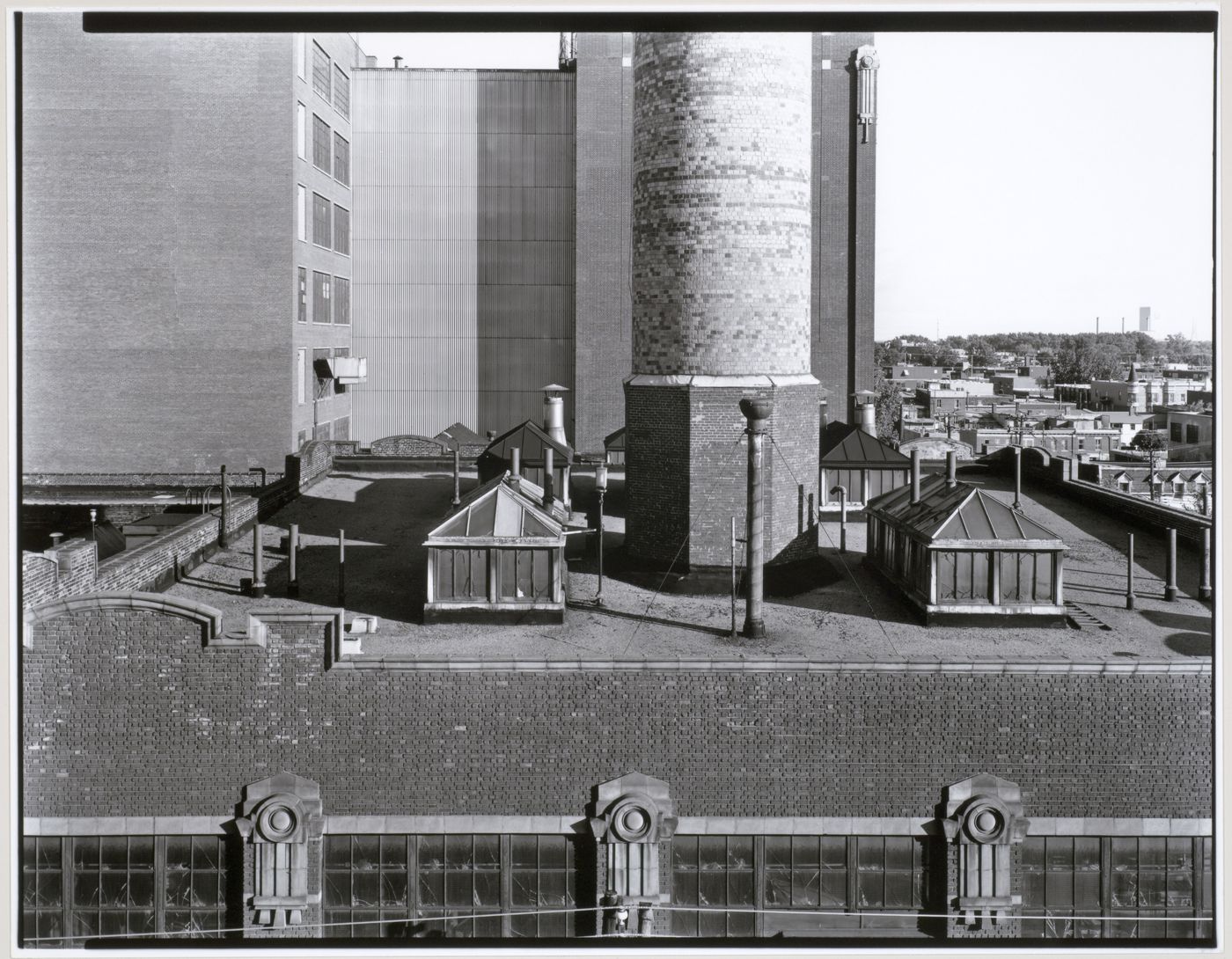 View of the smokestack of the Northern Electric Company Building from the roof of the Belding Corticelli Spinning Mill, Montréal, Québec