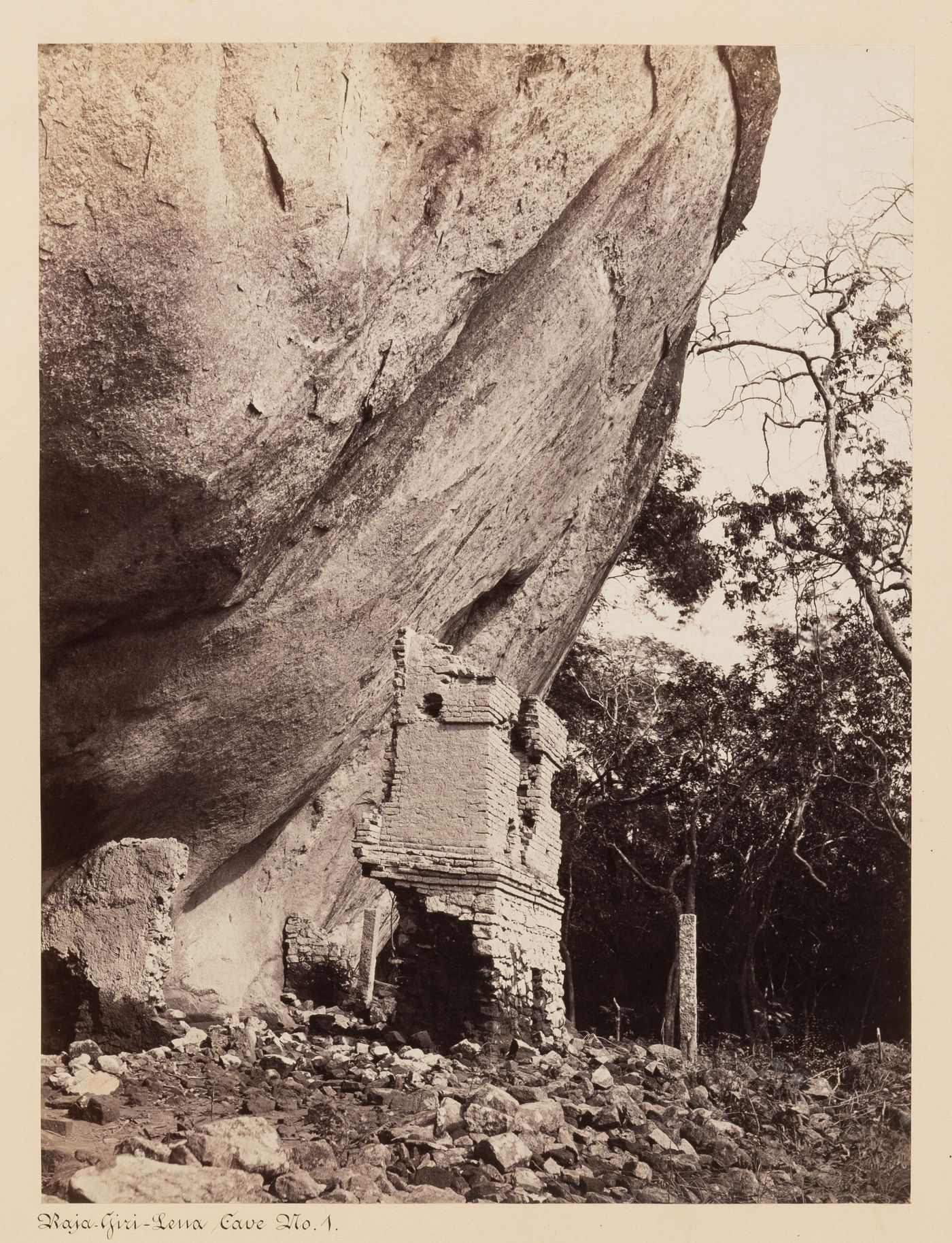 View of the ruins of a brick building, possibly known as Cave No. 1, Raja-Giri-Lena (also known as Raja-Giri-Lena-Kande and Care Mountain), Mihintale, Ceylon (now Sri Lanka)