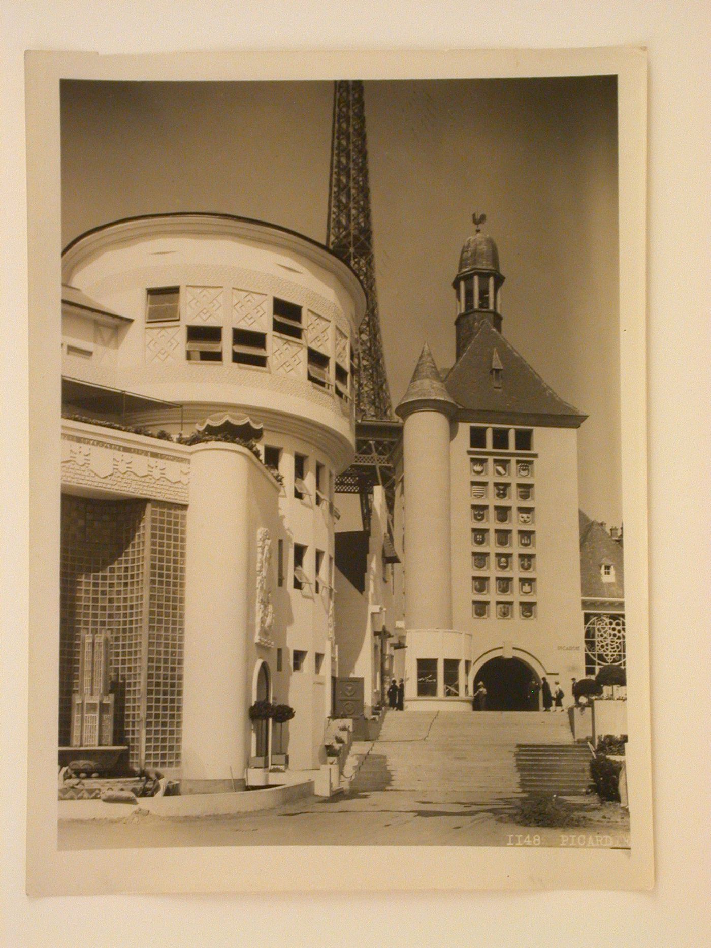 Partial view of Champagne's pavilion in the foreground and Picardie's pavilion and Tour Eiffel in the background, 1937 Exposition internationale, Paris, France