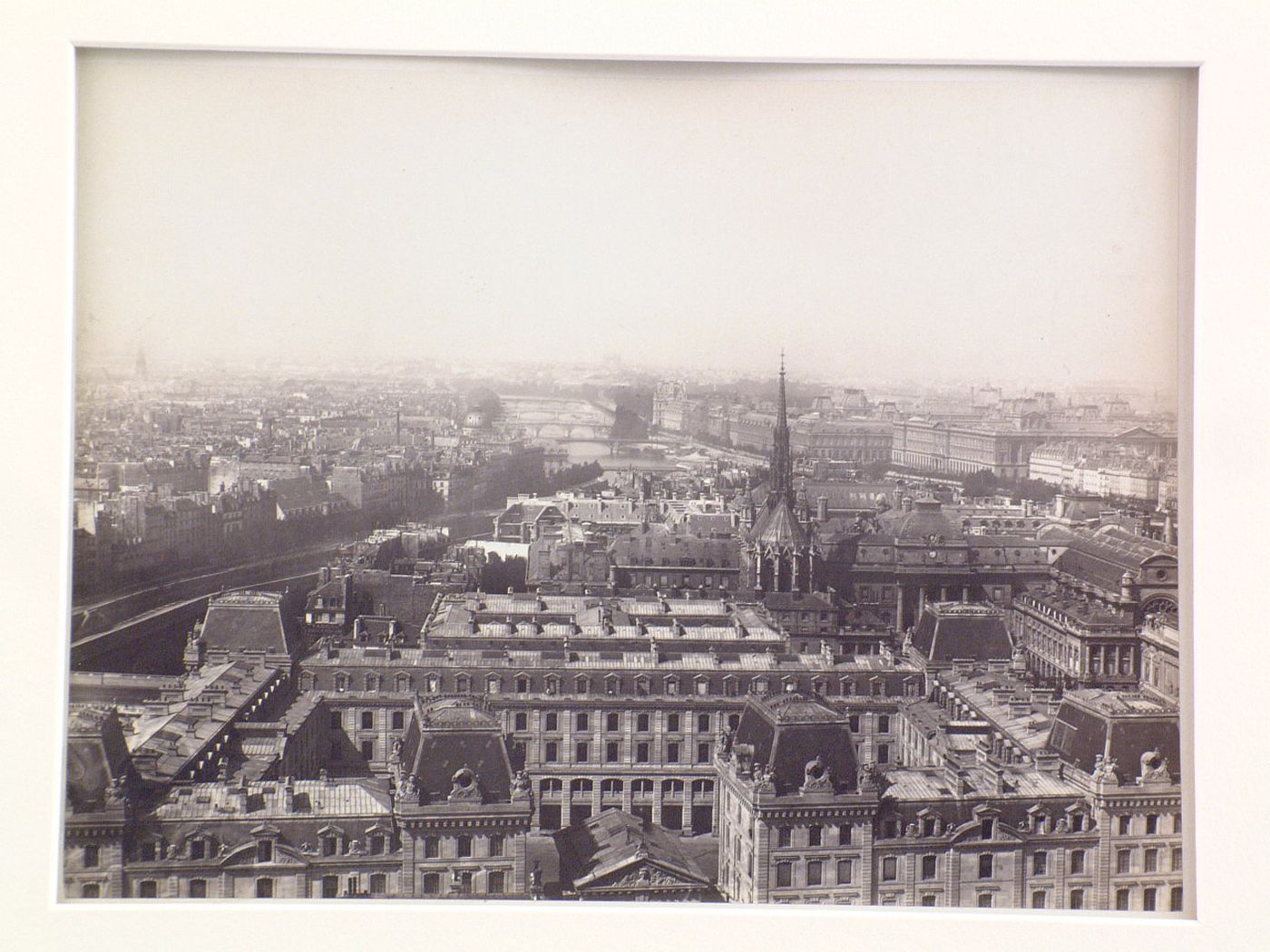 General view of Ile de la Cité, with Sainte Chapelle and Palais de Justice, Louvre in distance, possibly taken from spire of Notre-Dame, Paris, France