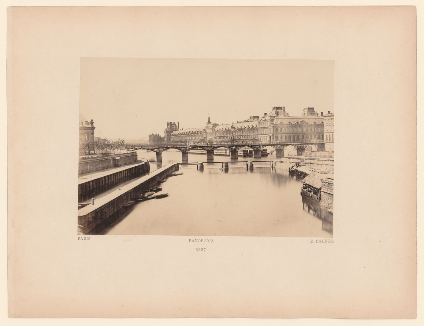 View of the Seine and the Louvre, with bridge in middle distance, Paris, France