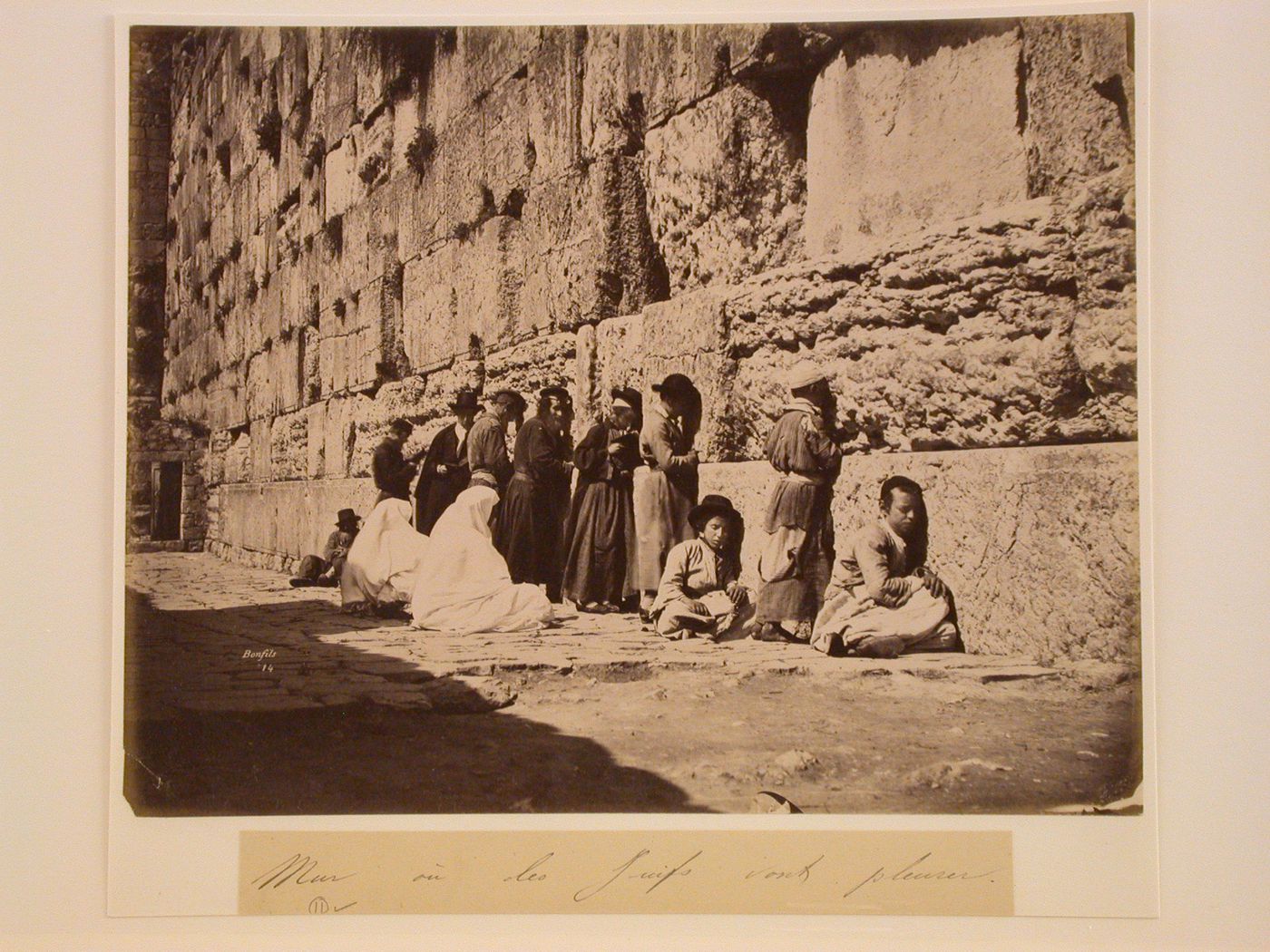 View of a group of Jewish people praying beside the Western Wall, Jerusalem, Palestine