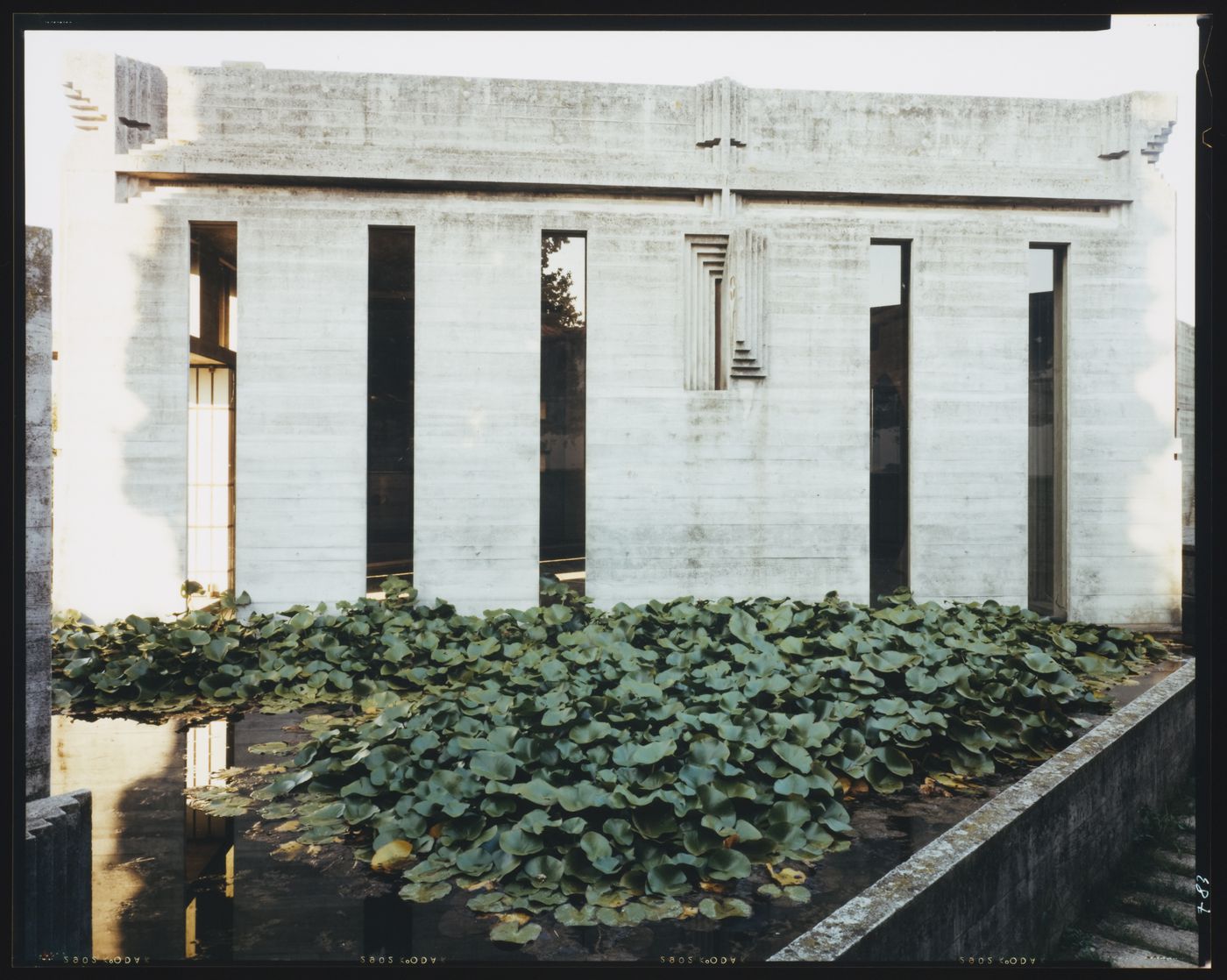 Partial view of the chapel with a pond in the foreground, Cimitero Brion, San Vito d'Altivole, near Asolo, Italy