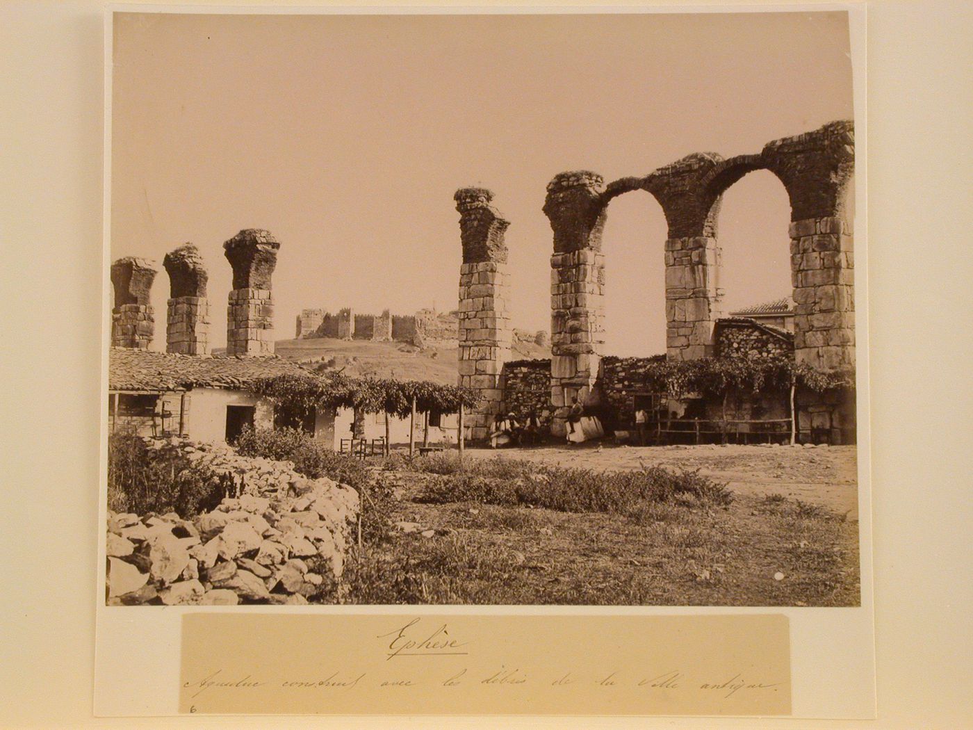 View of an aqueduct and buildings, Ephesus, Ottoman Empire (now in Turkey)