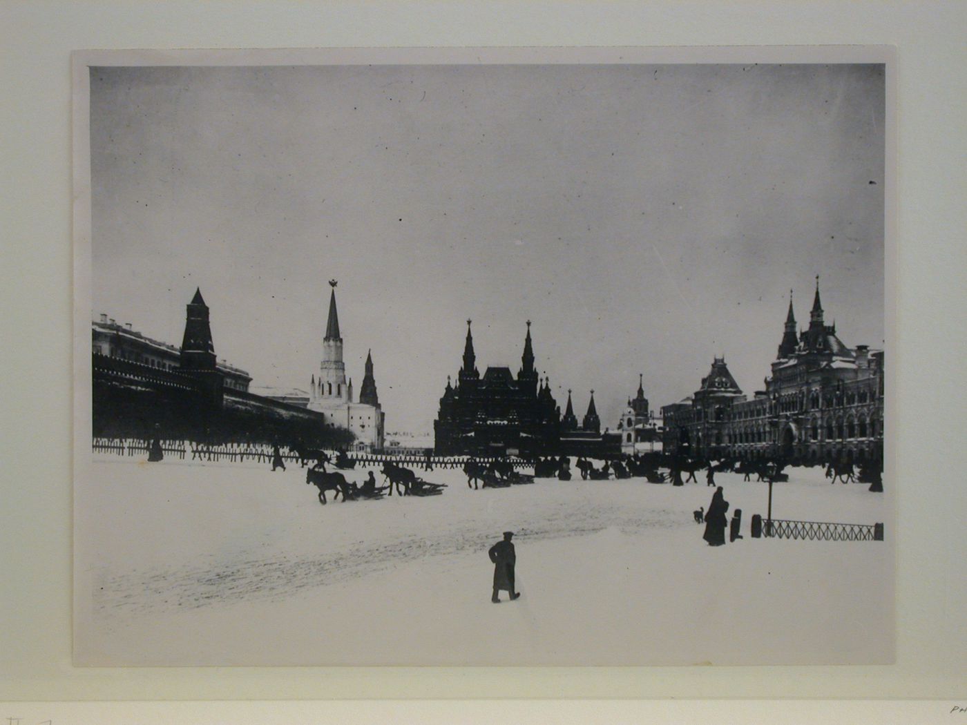 View of Red Square showing the Kremlin Wall and towers on the left, the Historical Museum in the center, and the Upper Shopping Arcades on the right, Moscow