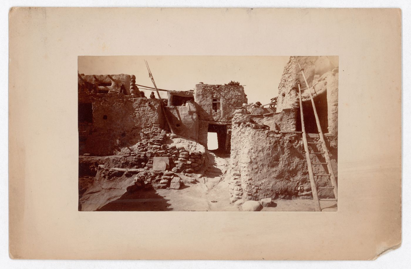 View of terraced houses (possibly Hopi), rooftop cooking areas and ladders, United States