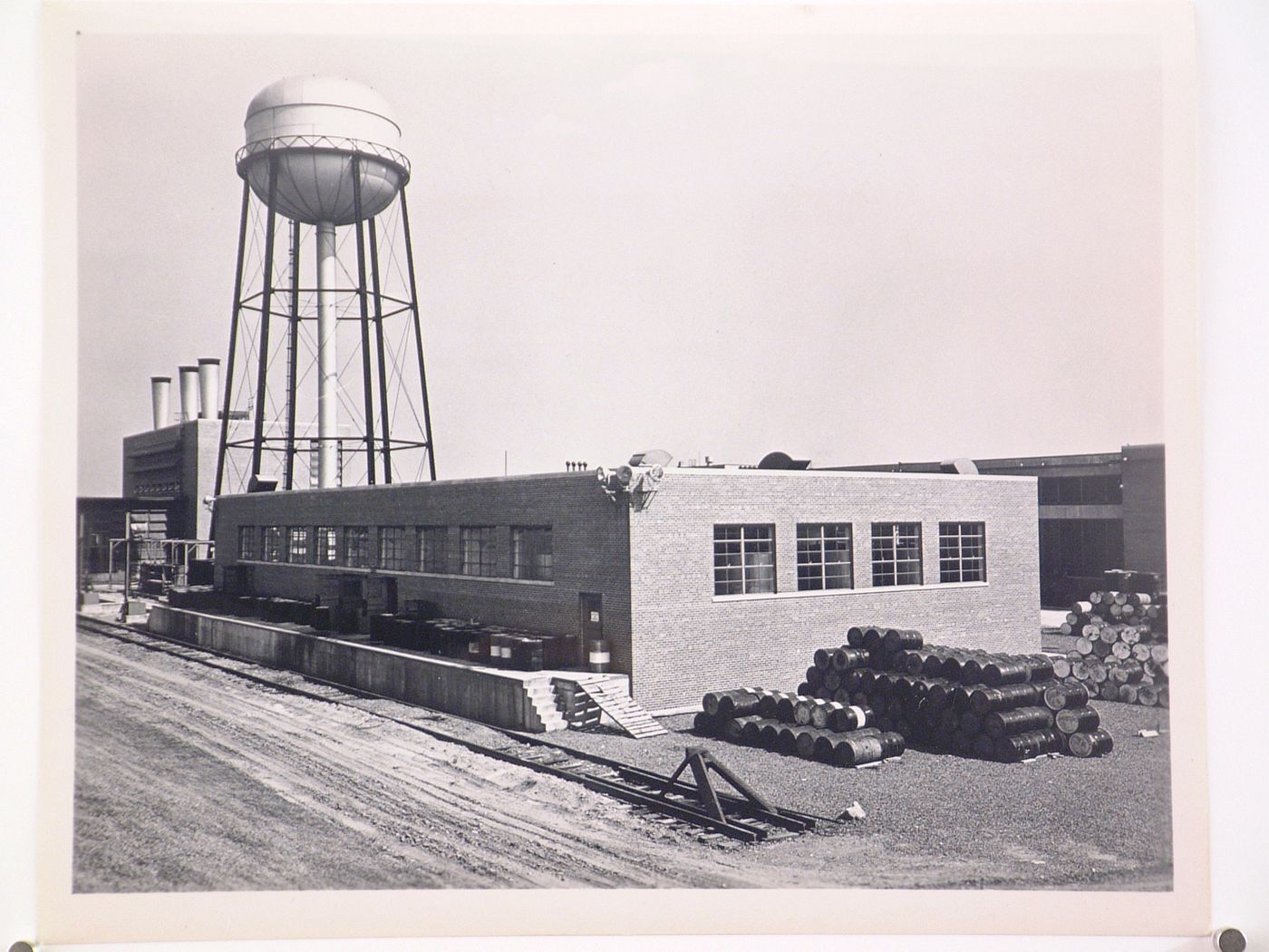 View of the Oil House in the foreground and the water tower and Boiler House in the background, Ford Motor Company Lincoln-Mercury division Automobile Assembly Plant, Metuchen, New Jersey