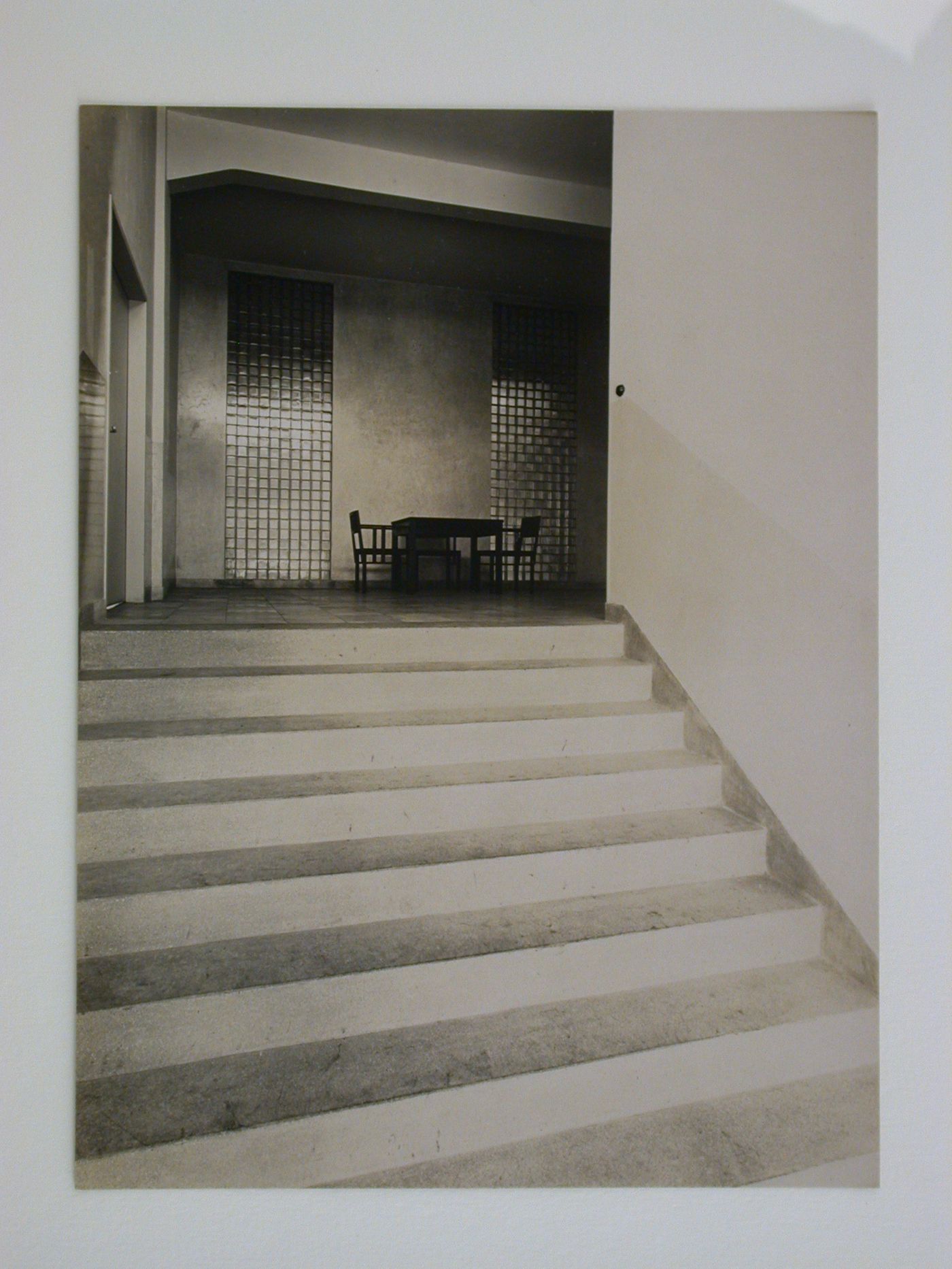 Interior view of inspection agency for electrical works, showing stairs to landing with table and chairs, Frankfurt am Main, Germany