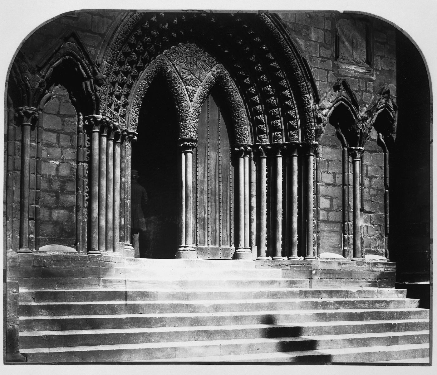 View of south transept portal and steps, with a figure in the doorway, Lichfield Cathedral, Lichfield, England