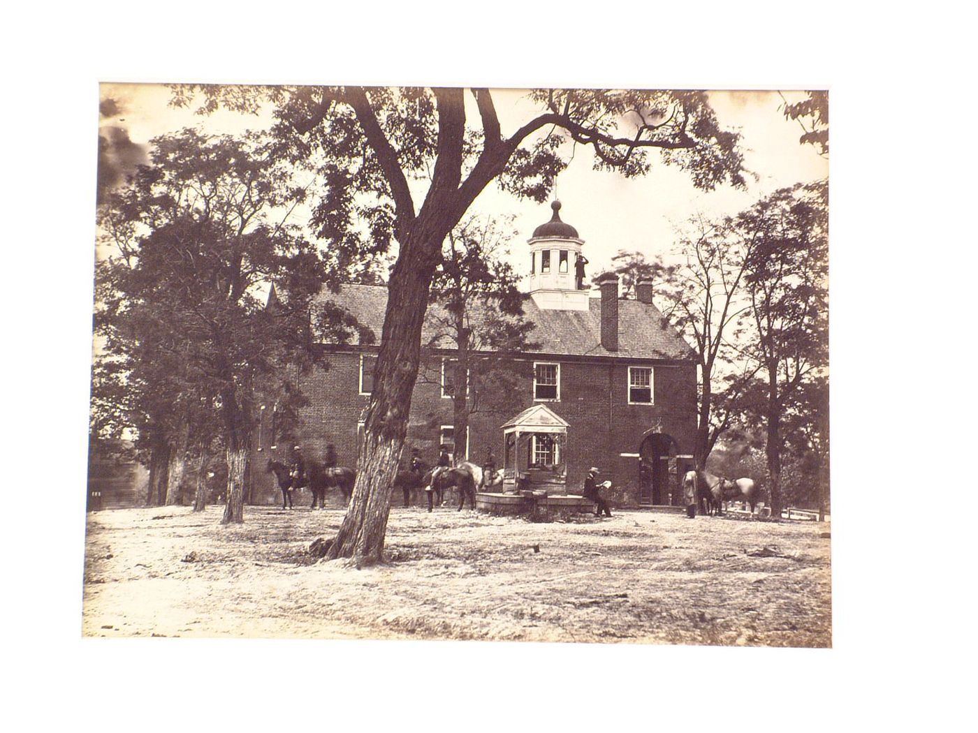 View of the Fairfax County Courthouse with soldiers on horseback in the foreground, Fairfax, Virginia, United States