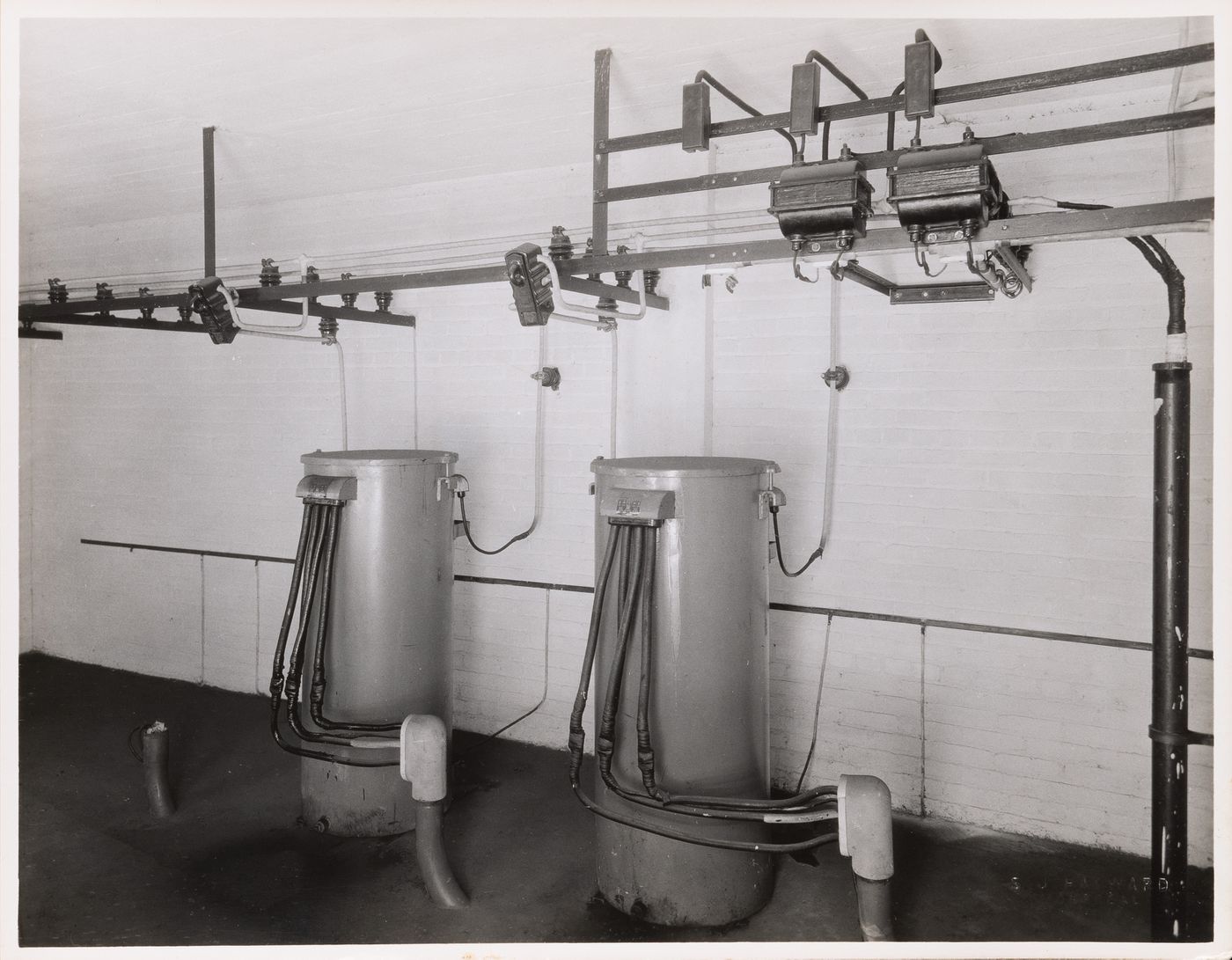 Interior view of the electrical system including step-down transformers [?] and electric conduits, Collège Grasset, Montréal, Québec