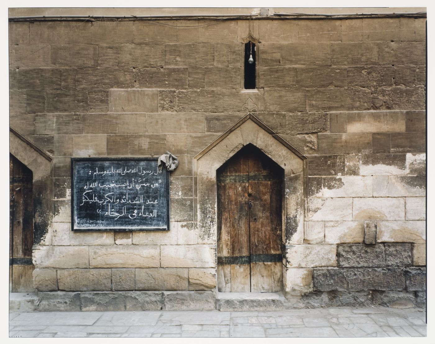 Tomb of Shayku, exterior view of entrance doors, blackboard on façade, Cairo, Egypt