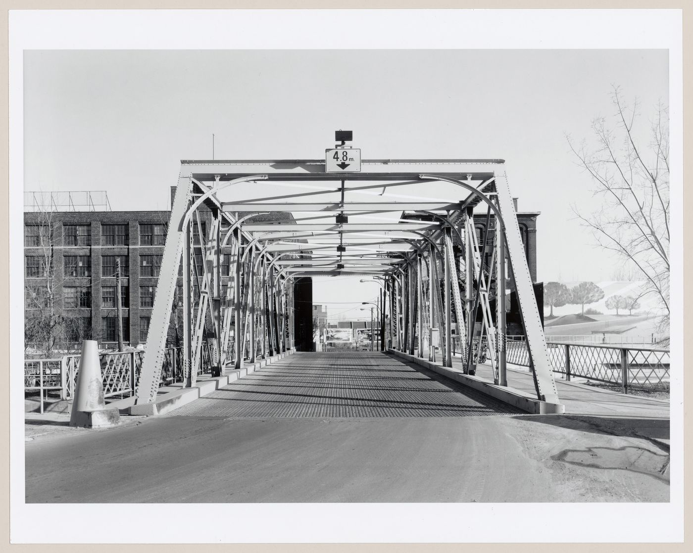 View of the Des Seigneurs Bridge from the north bank of Lachine Canal showing the Belding Corticelli Spinning Mill on the left and the Phillips Electrical Works Building on the right, Montréal, Québec