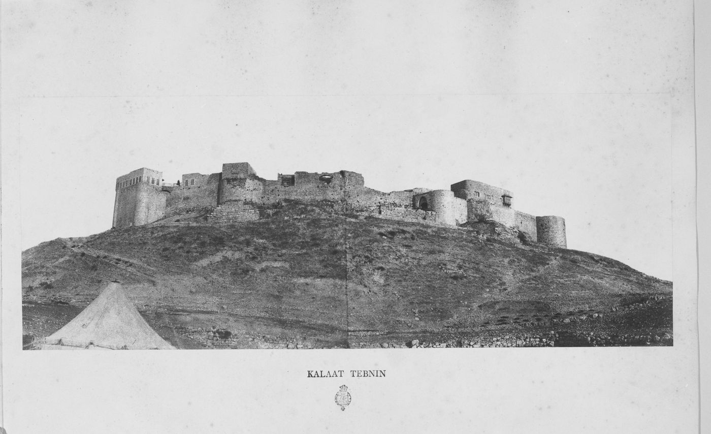 Distant view of the ruins of the Crusader Castle showing one of Emmanuel-Guillaume Rey's expedition tents in the foreground, Tibnin, Ottoman Empire (now in Lebanon)