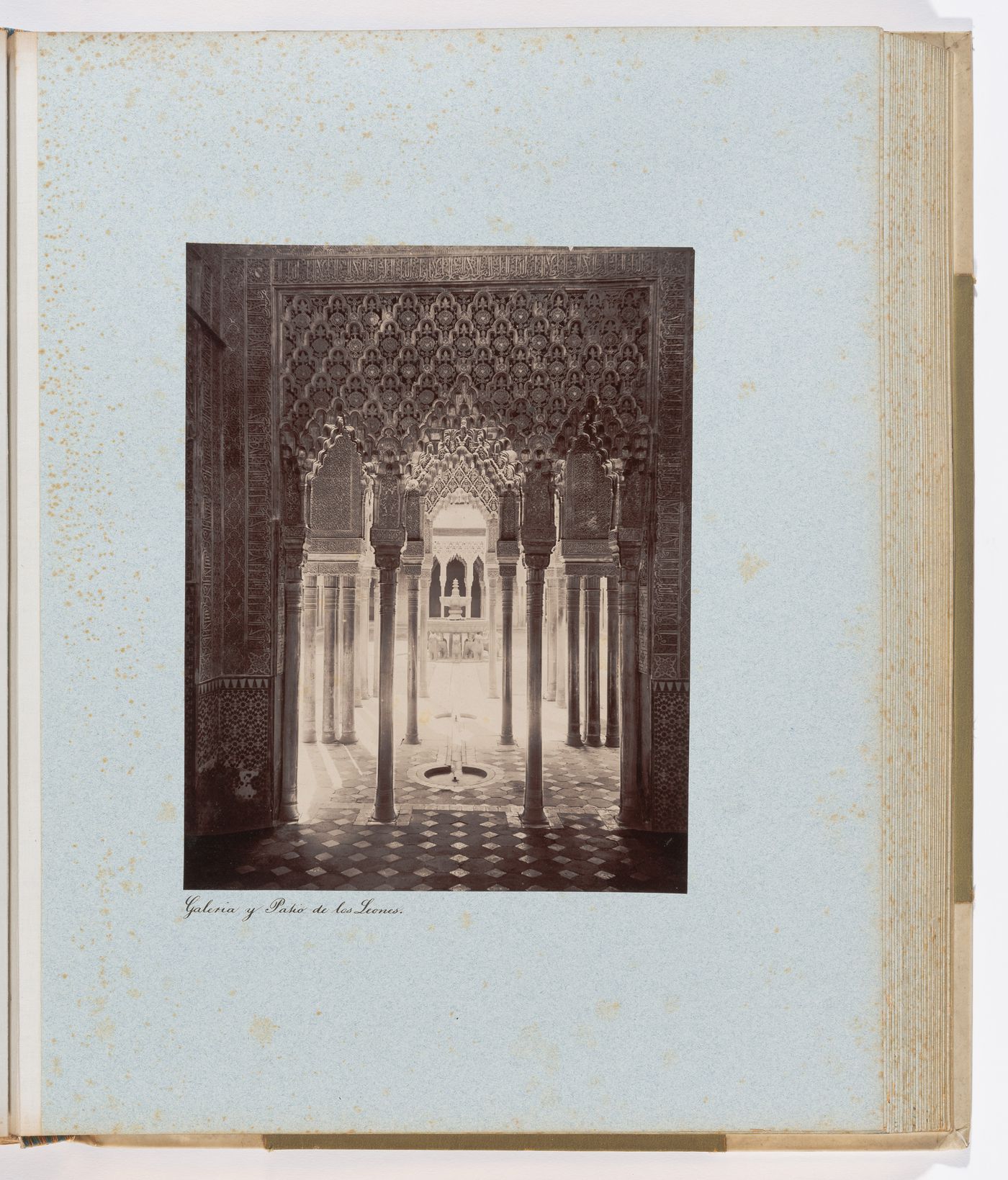 View of arches, pillars, and central fountain in Court of the Lions, from east pavilion, Alhambra, Granada, Spain

