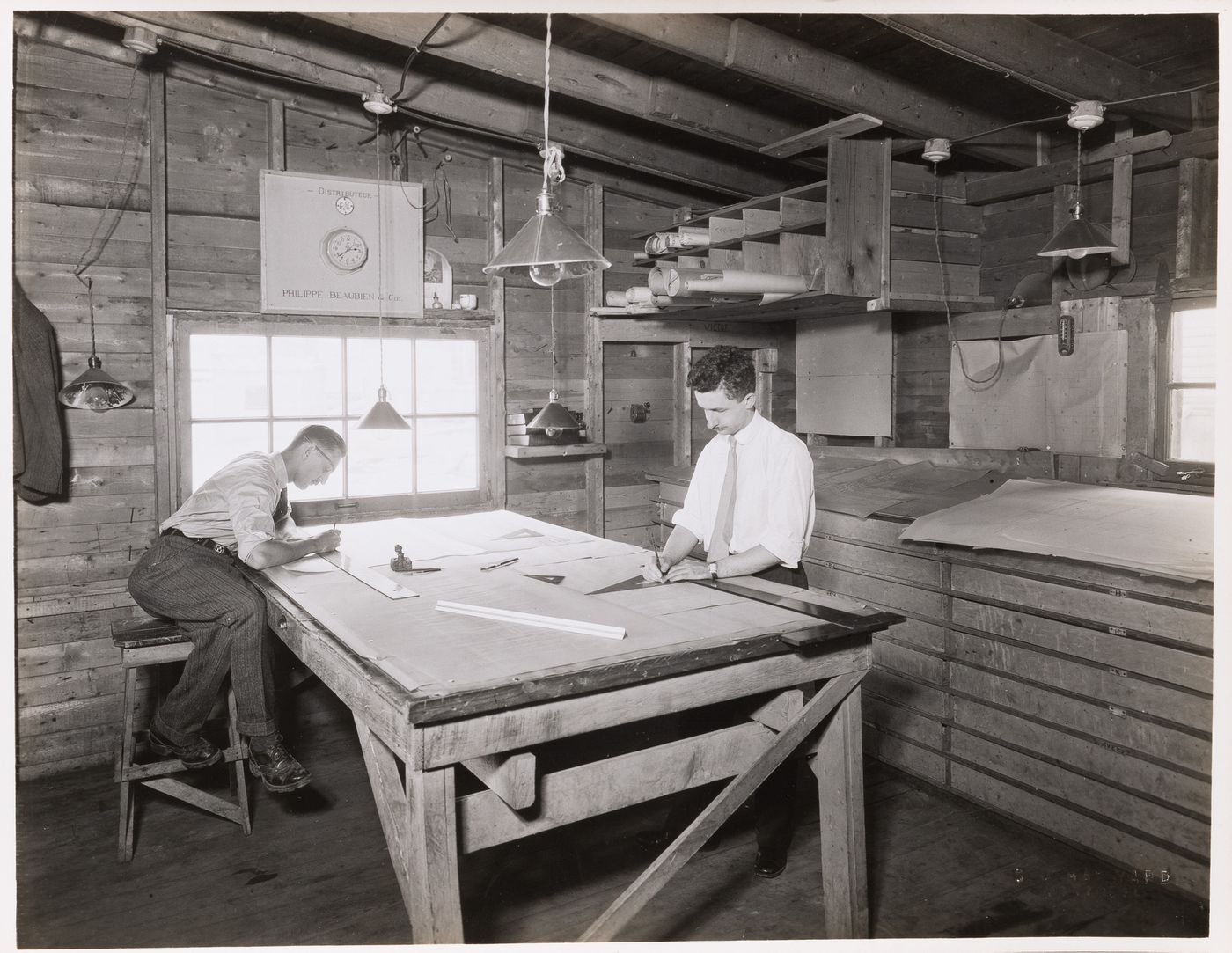 Interior view of a workshop [?] showing draughtsmen at work, Montréal [?], Québec