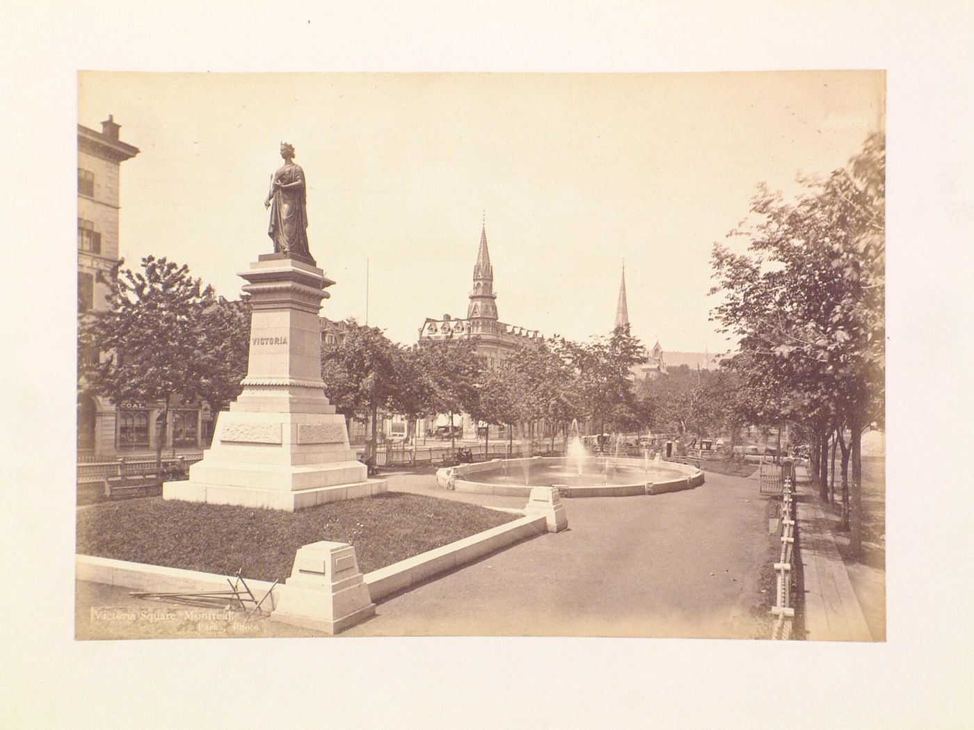 View of Victoria Square showing the monument to Queen Victoria with the old YMCA Headquarters in the background, Montréal, Québec