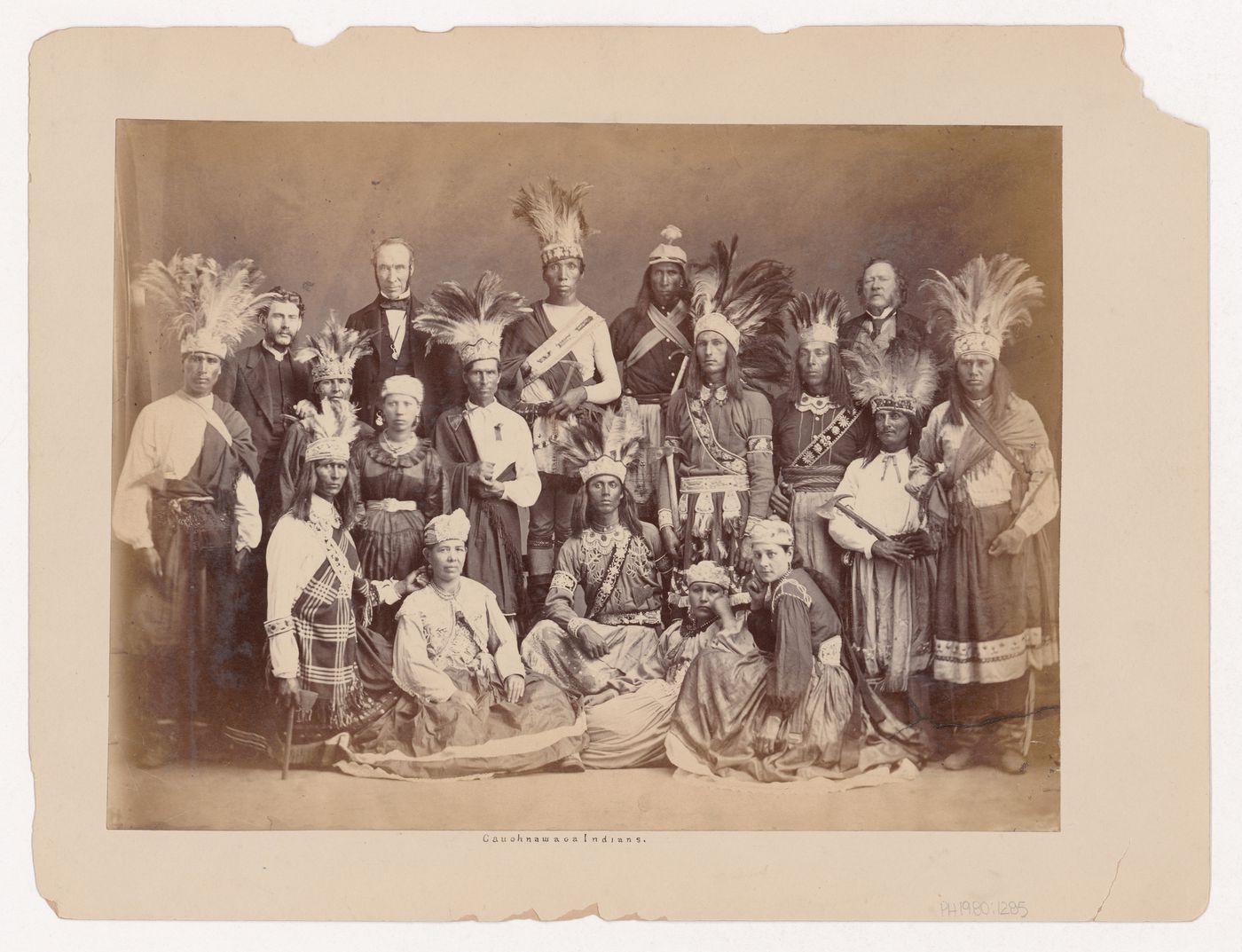 Group portrait of Kanien'kehaka (Mohawk) men and women with William Workman, Mayor of Montréal, Kahnawake, Québec, Canada