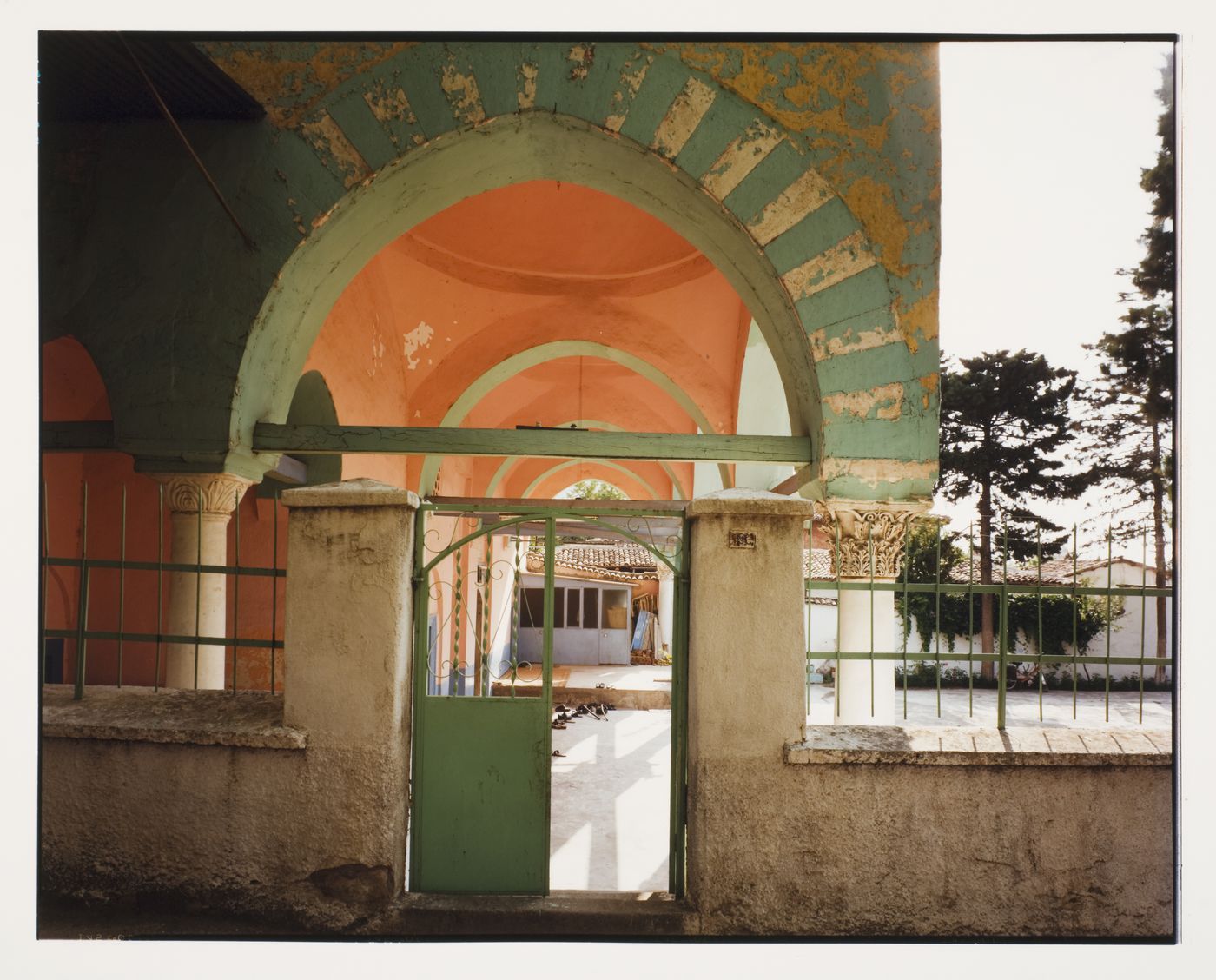 View of the entrance gate of a mosque complex showing the portico of the mosque, Manisa [?], Turkey