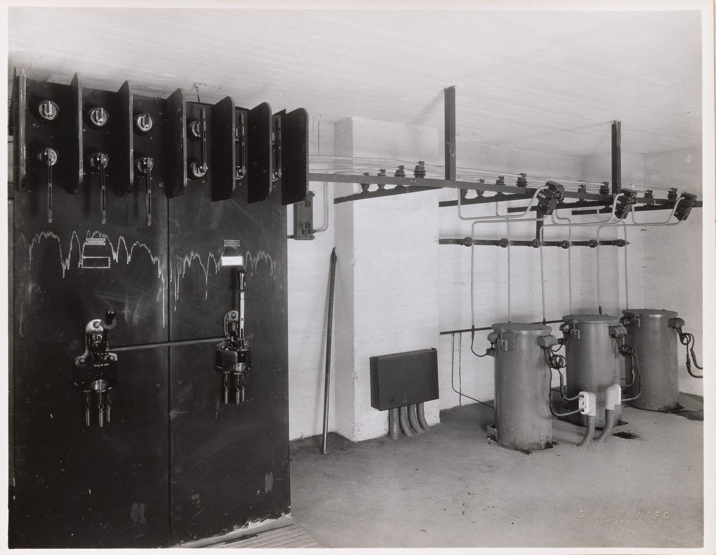 Interior view of the electrical system including step-down transformers [?], electric conduits and switches, and switchboards [?], Collège Grasset, Montréal, Québec