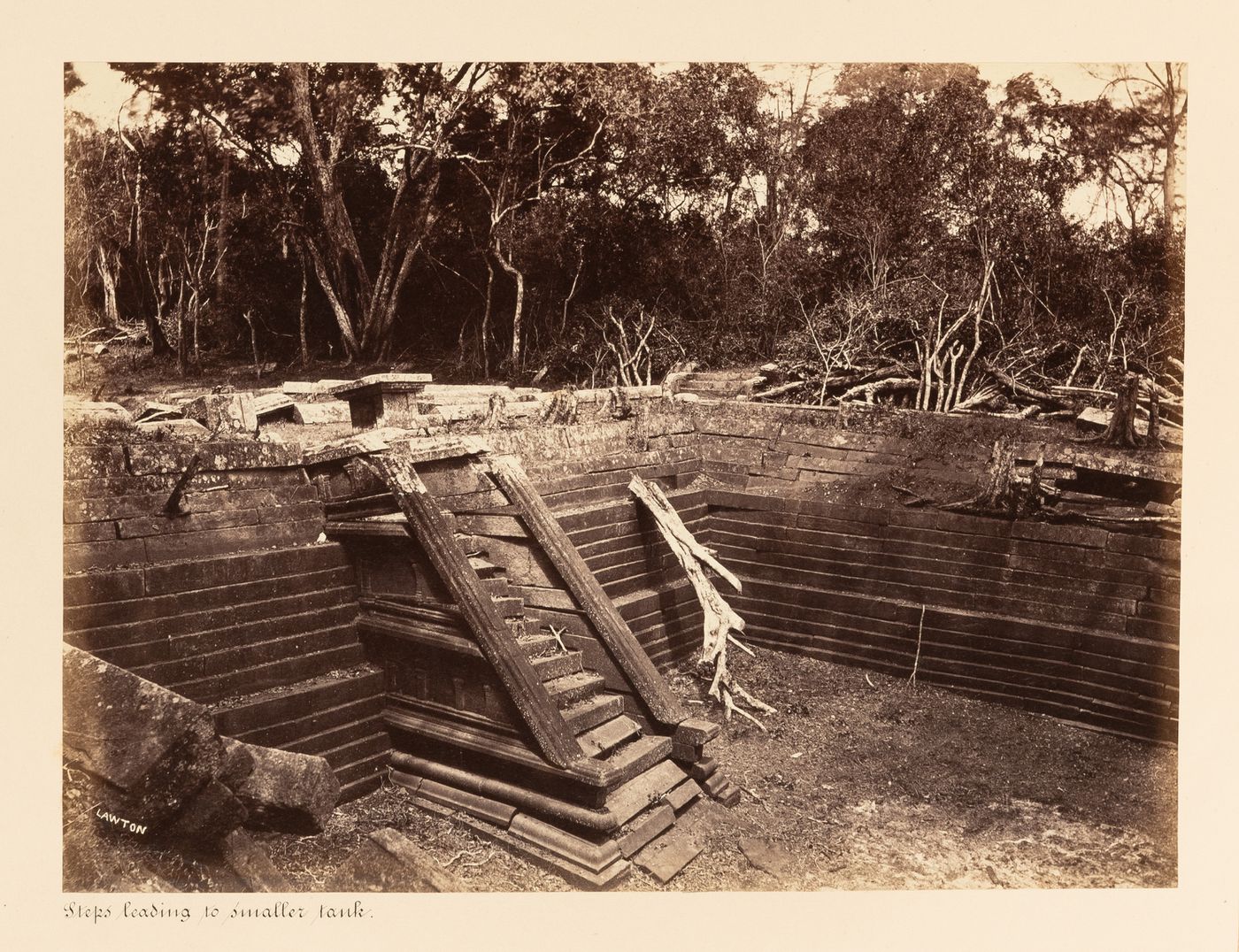 View of a staircase leading into a water tank, Kuttam Pokuna [Twin Ponds], Anuradhapura, Ceylon (now Sri Lanka)