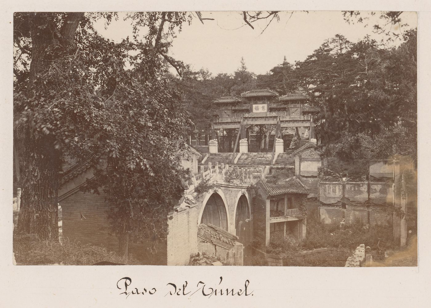 View of a bridge over Suzhou Creek and a p'ai-lou in the Back Hill area of the Garden of the Clear Ripples [Qingyi Yuan] (now known as the Summer Palace or Yihe Yuan), Peking (now Beijing),