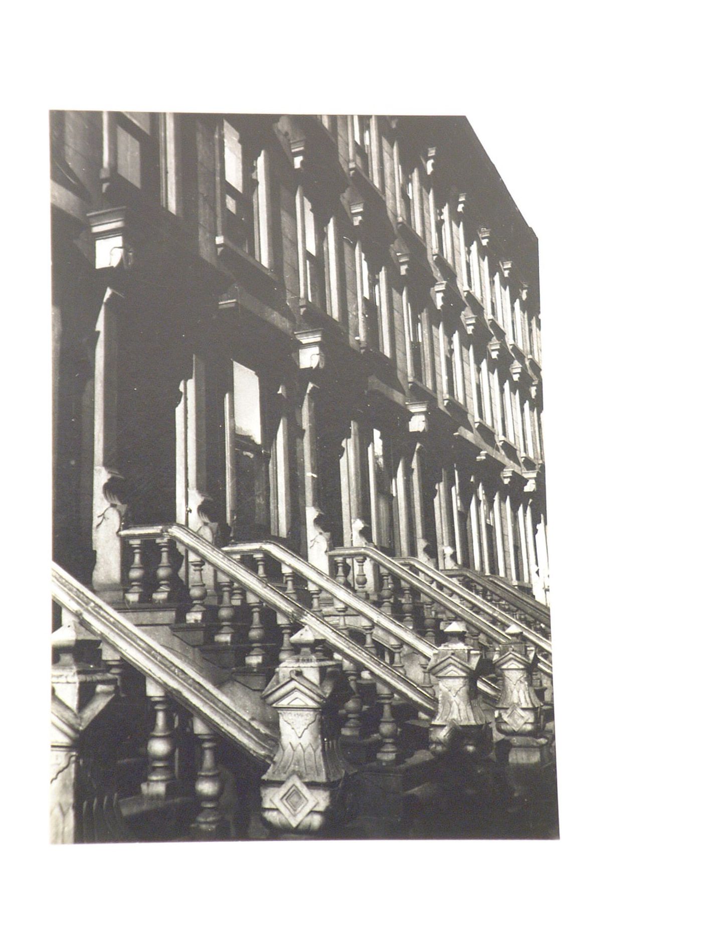 View of building façade with stone staircases, New York City, New York