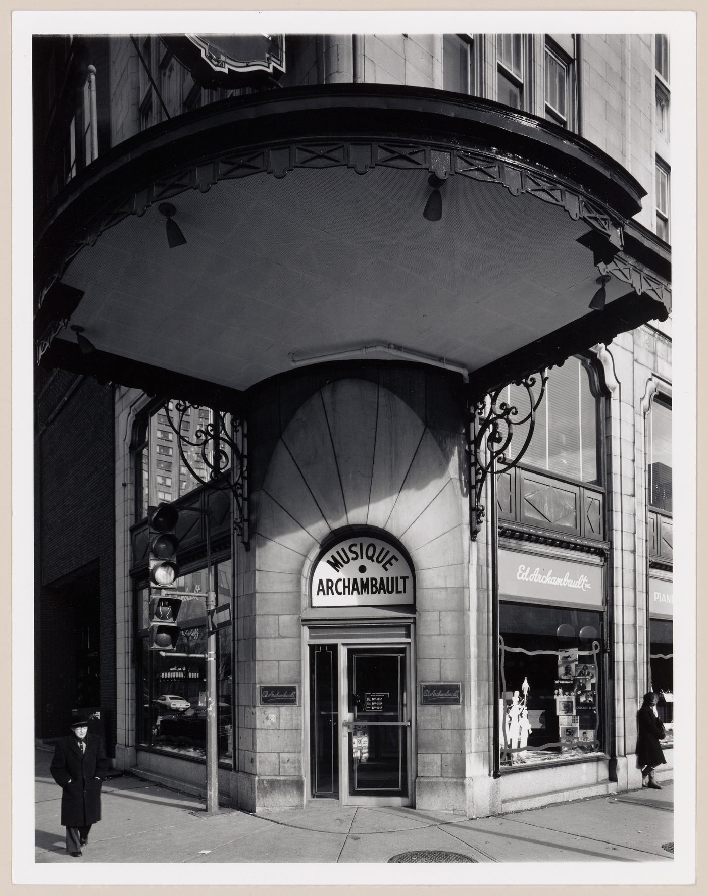 View of the main entrance of Musique Archambault showing the marquee and display windows, 500 rue Sainte-Catherine Est, Montréal, Québec