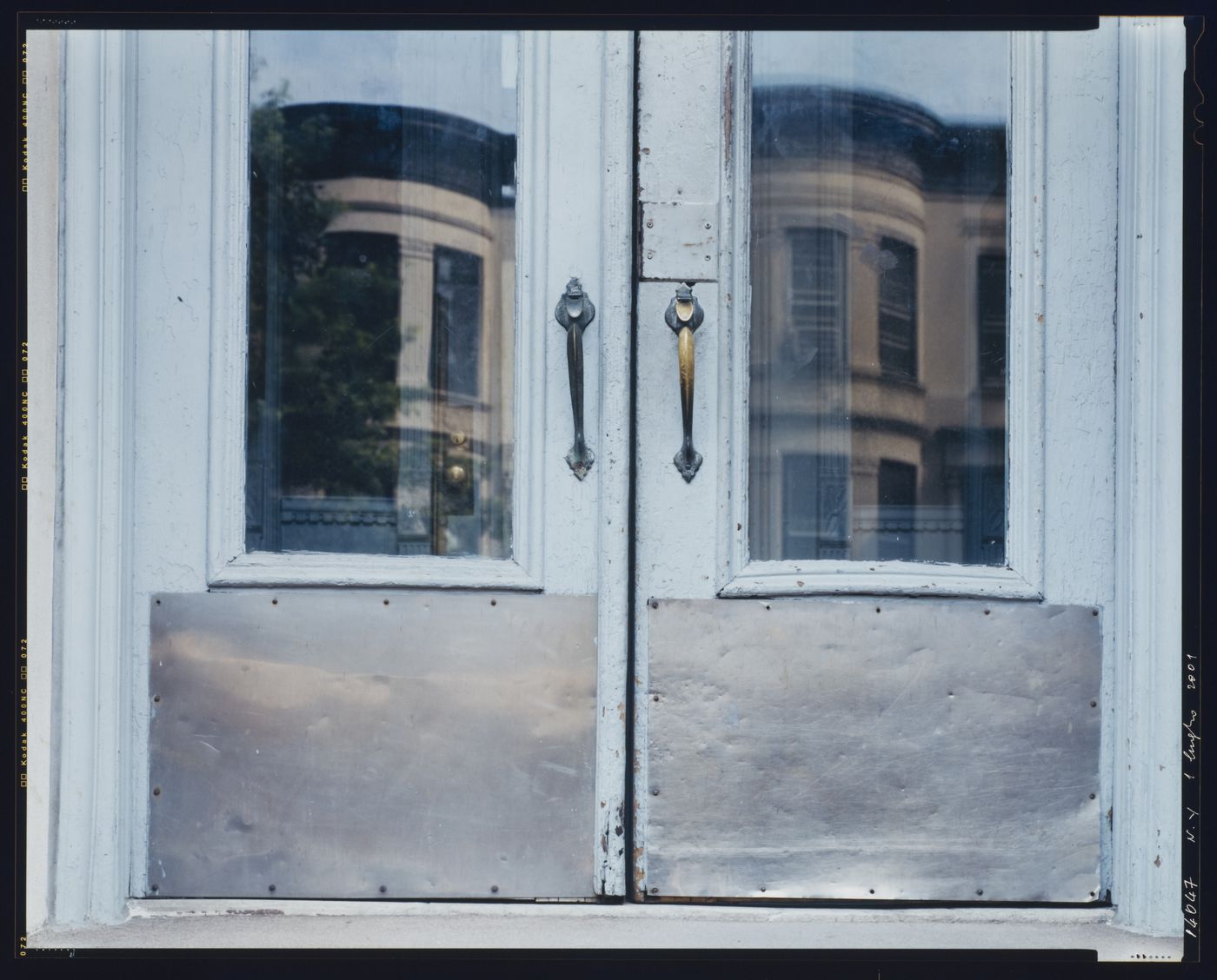 Close-up view of the lower portion of a residential building's double doors, 8th Street, Brooklyn, New York City, New York