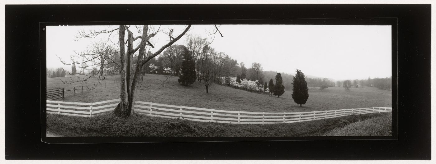 View of a field delimited by a white wooden fence, Virginia