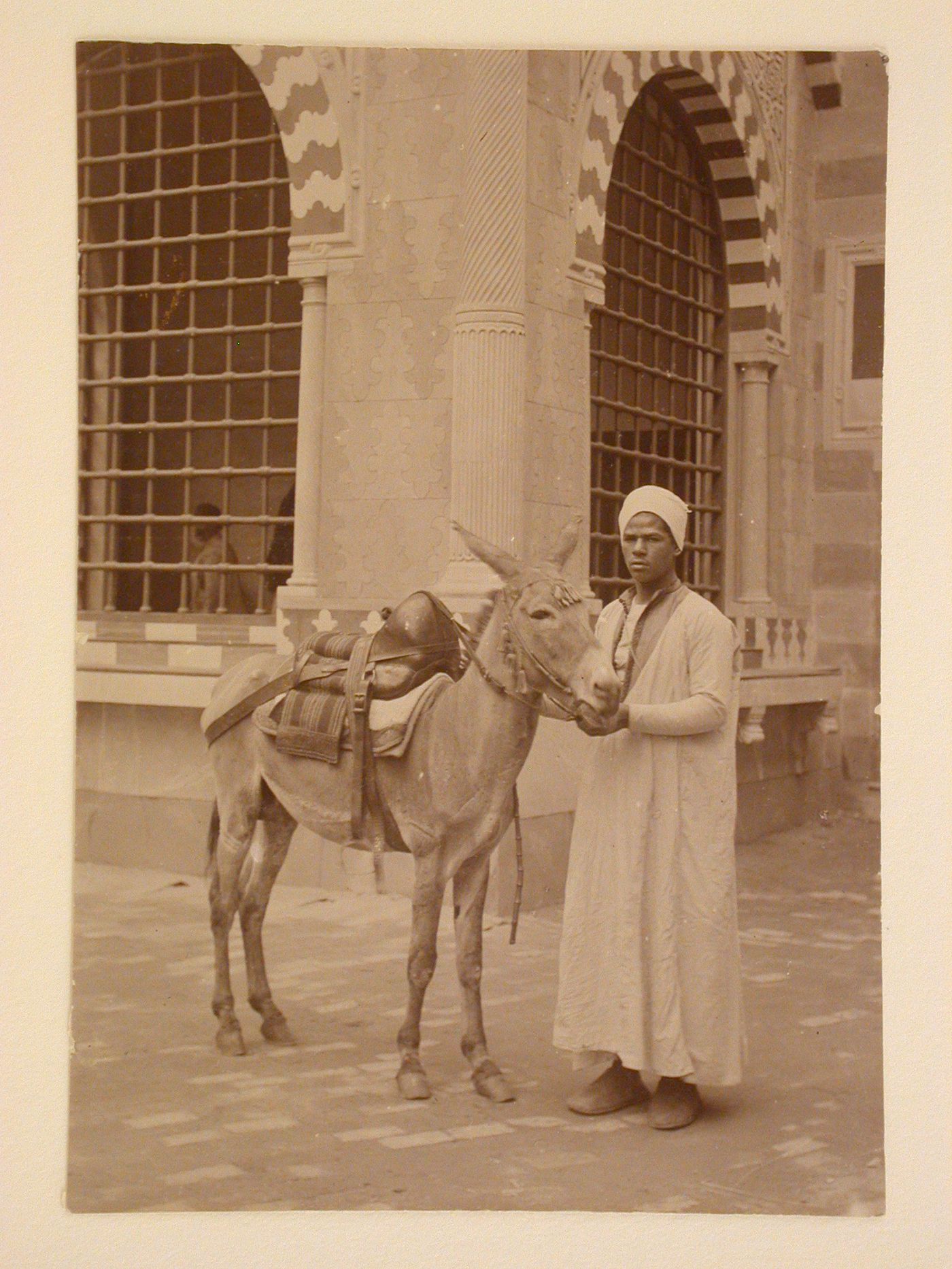 Portrait of a man with a donkey on Cairo [?] Street, 1893 Chicago World's Columbian Exhibition, Chicago, Illinois