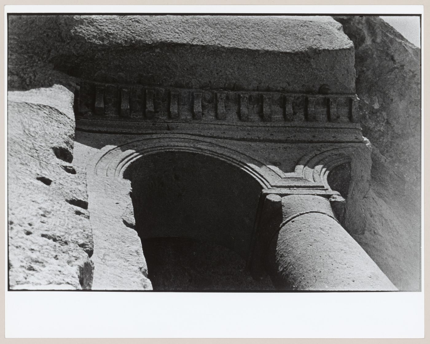 Partial view of the arcaded porch of St. John the Baptist Church showing a column, arches and dentils, Cavusin, Cappadocia, Turkey