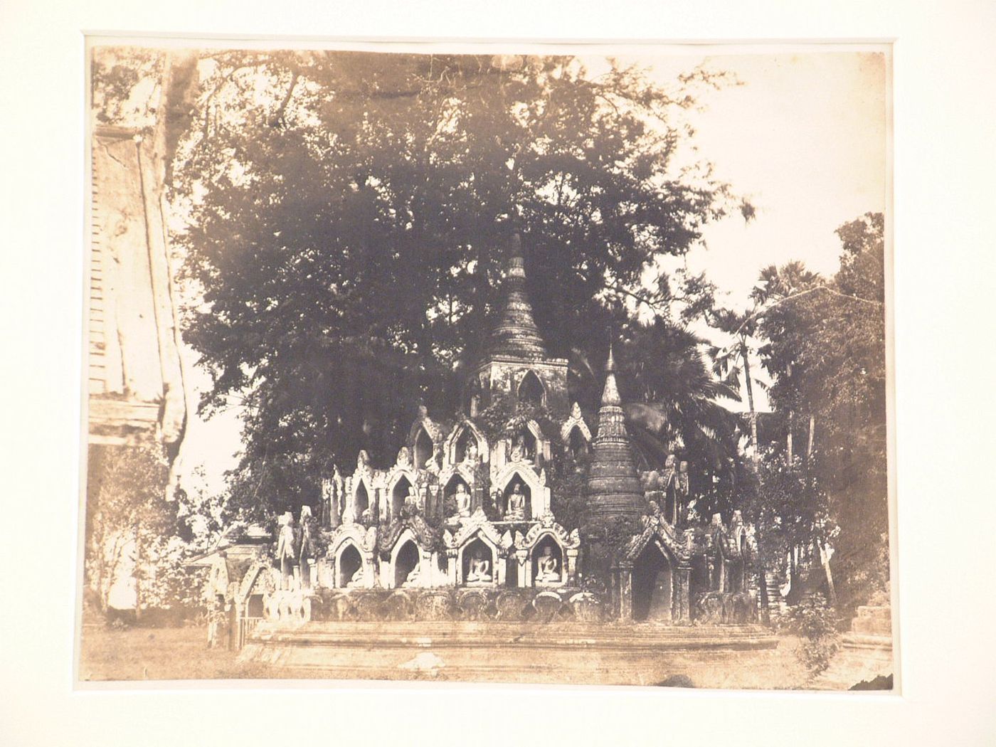 View of a stupa showing niches and statues of Buddha, Shwedagon Pagoda, Rangoon (now Yangon), Burma (now Myanmar)