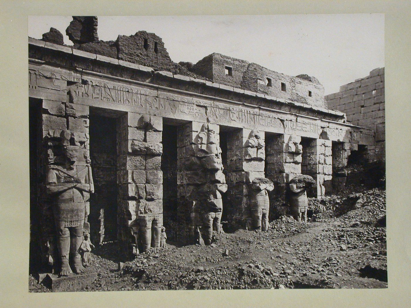 Mortuary Temple of Ramesses III, First Court, row of Osiride pillars forming north colonnade, Medinet Habu, Thebes, Egypt