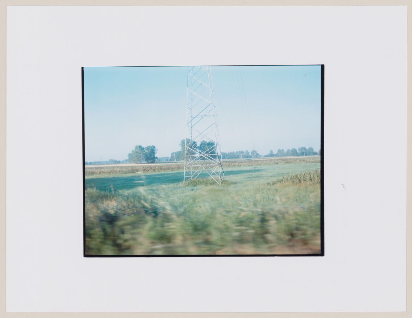 View of electricity pylons and agricultural land, Strzelce Kraje'nskie, Poland (from the series "In between cities")