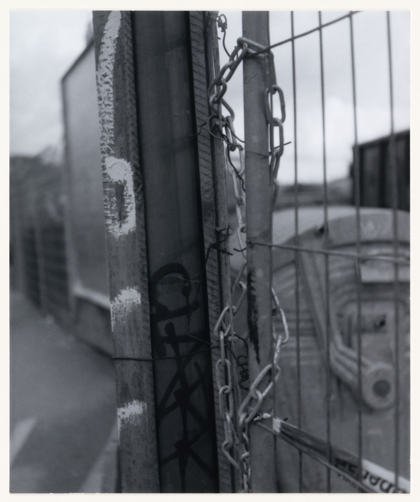 View of a fence, graffiti, posts and a chain, Berlin, Germany, from the artist book "The Potsdamer Project"