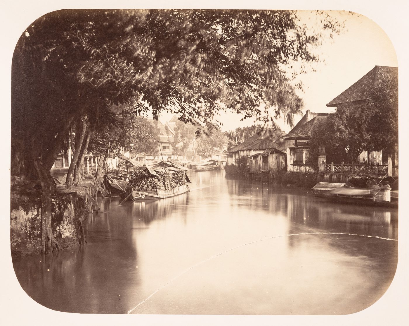 View of the river along Jalan Pancoran street showing houses, Batavia (now Jakarta), Dutch East Indies (now Indonesia)