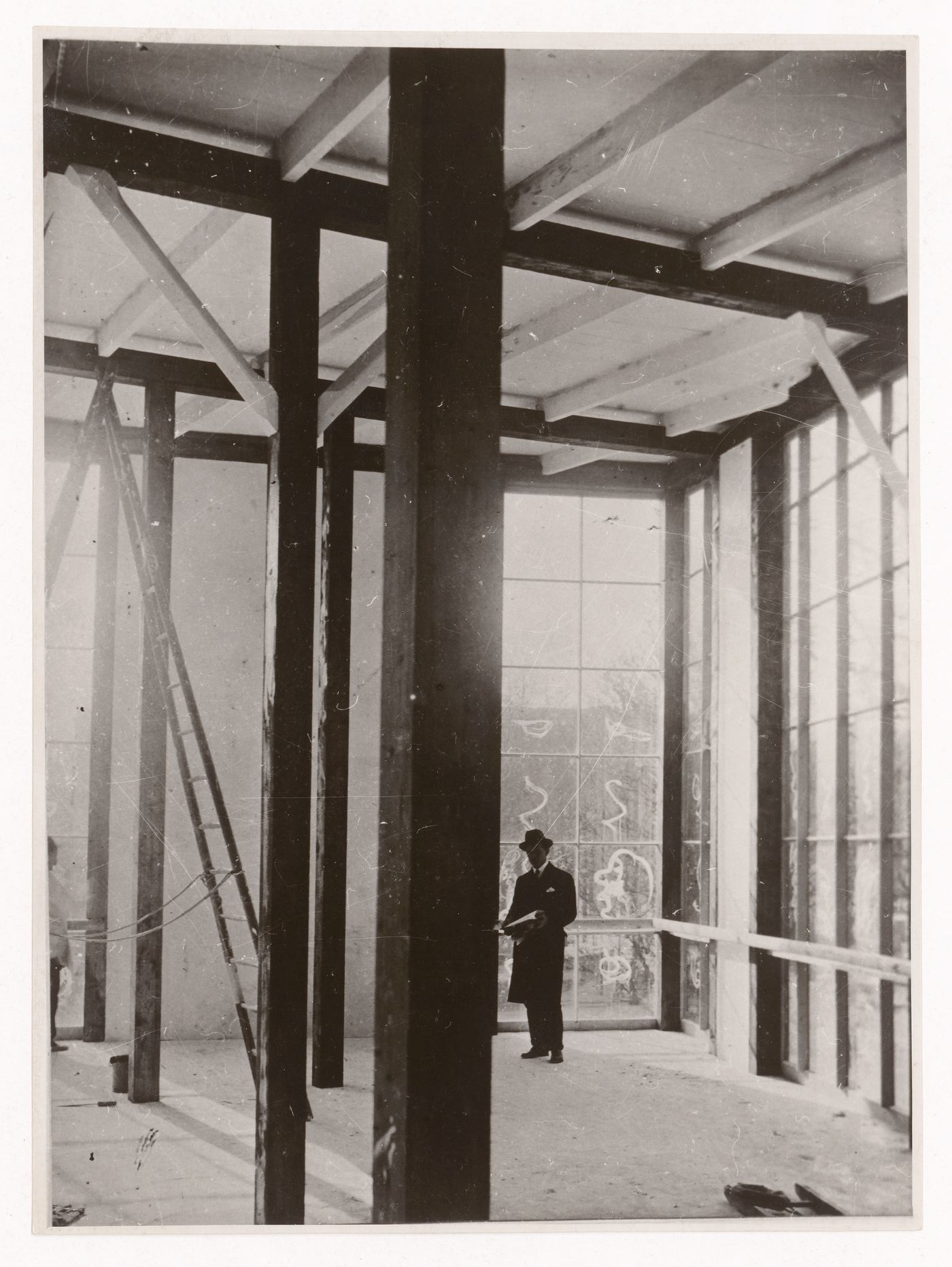 Interior view of the Soviet Pavilion, 1925 Paris Exhibition of the Decorative Arts with Melnikov in the background