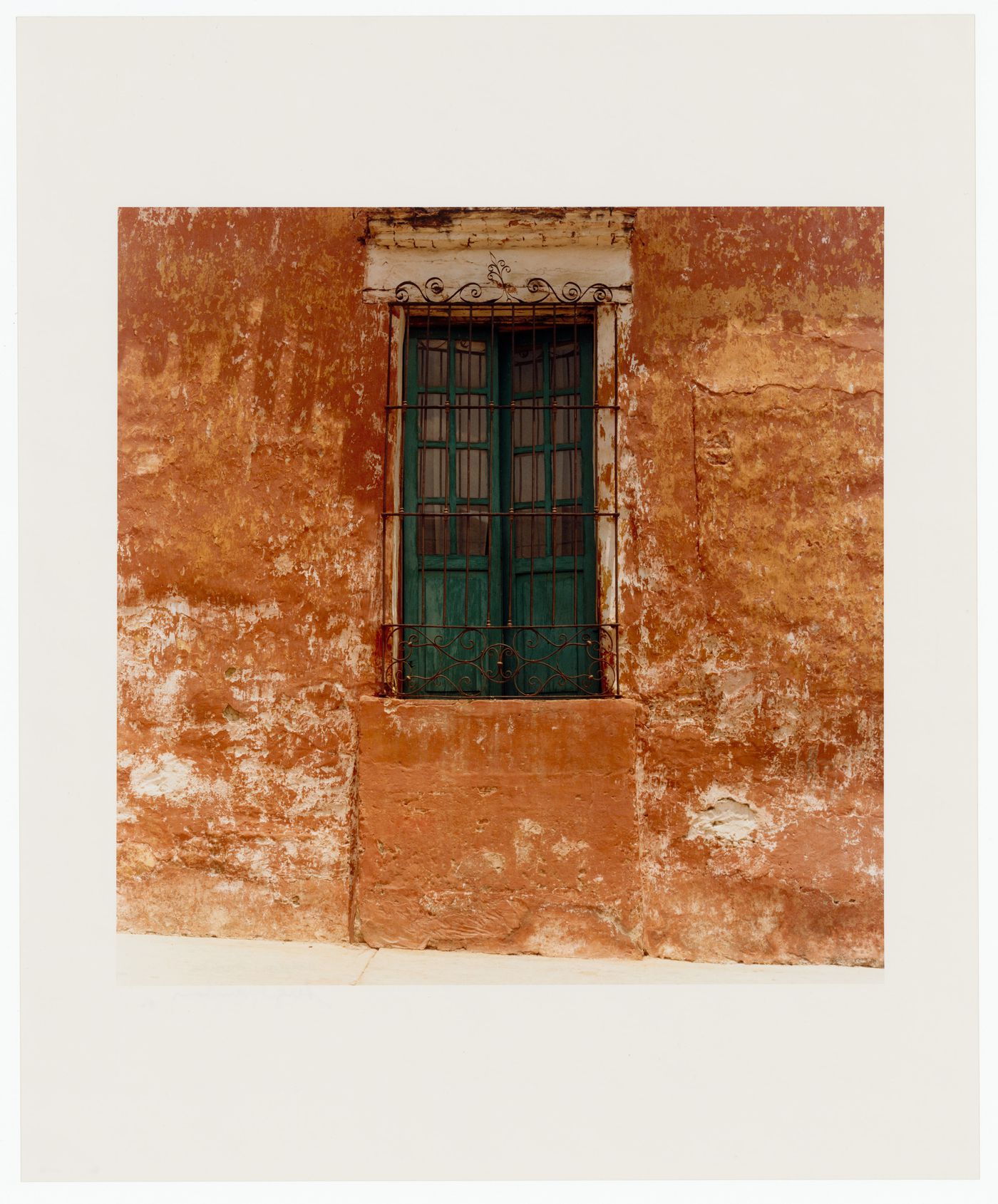 View of a balconet showing doors covered by a wrought iron grille, Oaxaca, Mexico