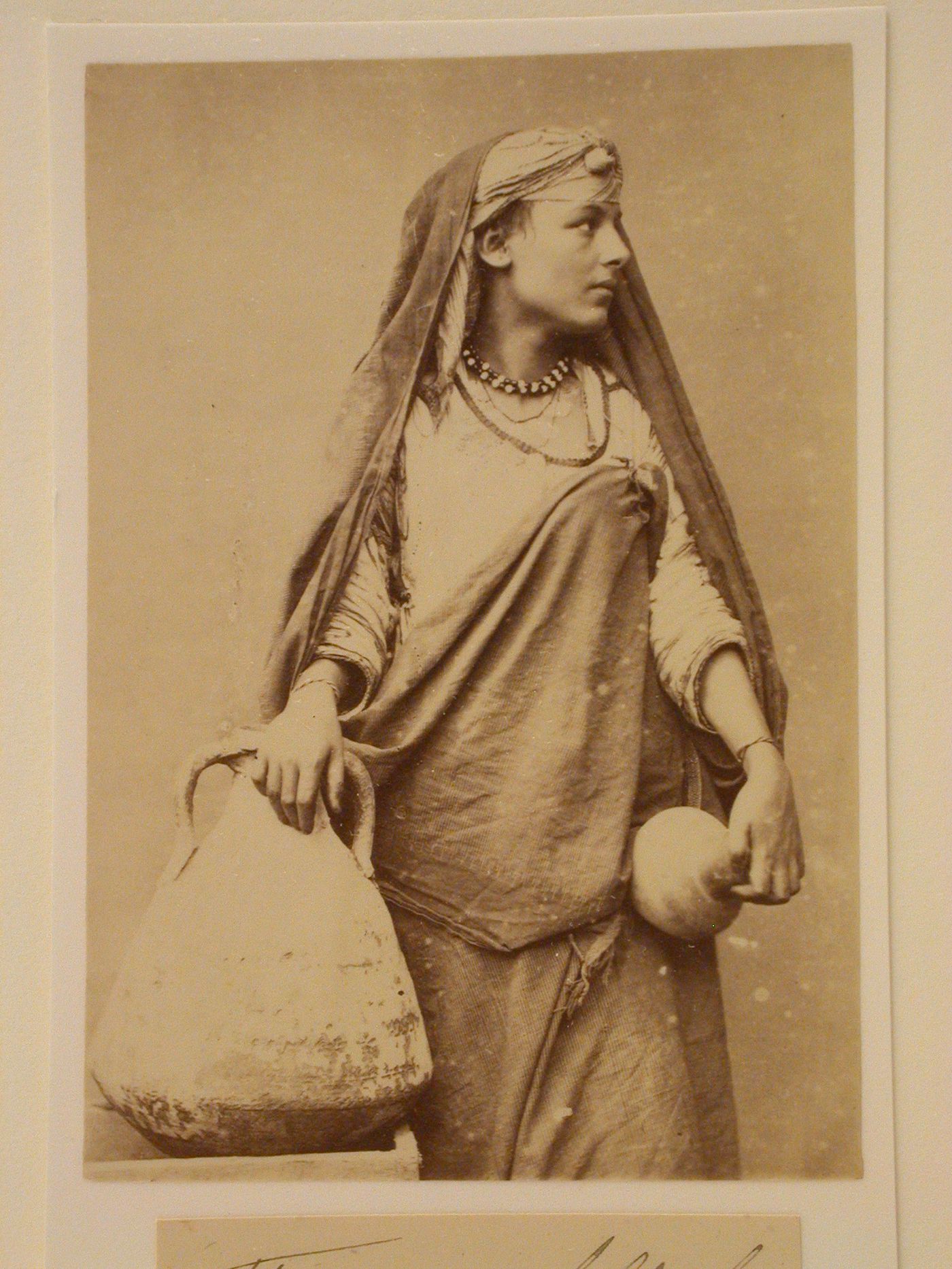 Standing woman with water jugs